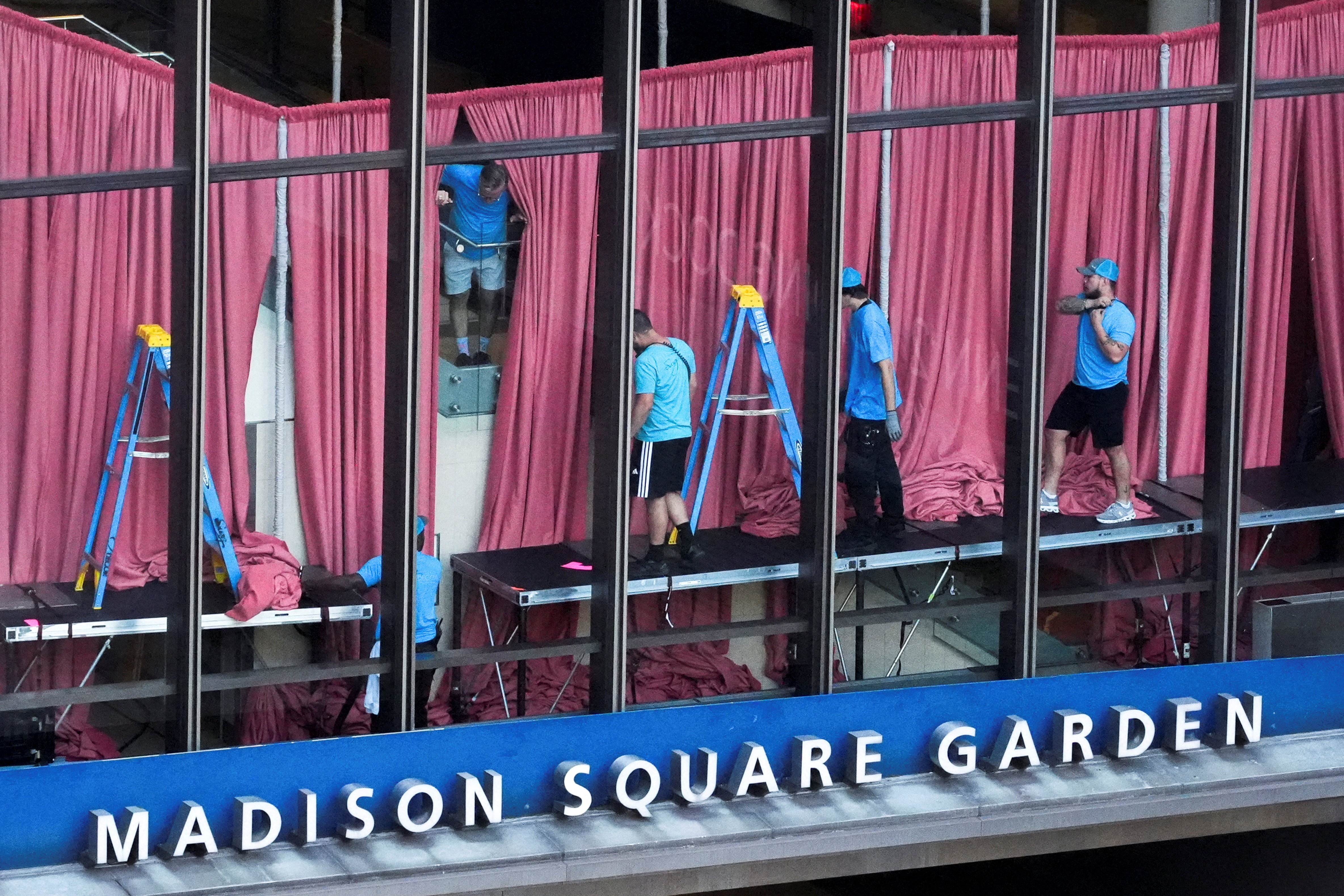 Workers setting up curtains inside Madison Square Garden on July 3, 2026