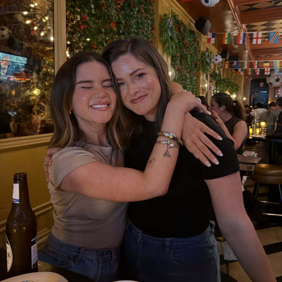 Maren Morris and Cassadee Pope kissing in an Instagram photo