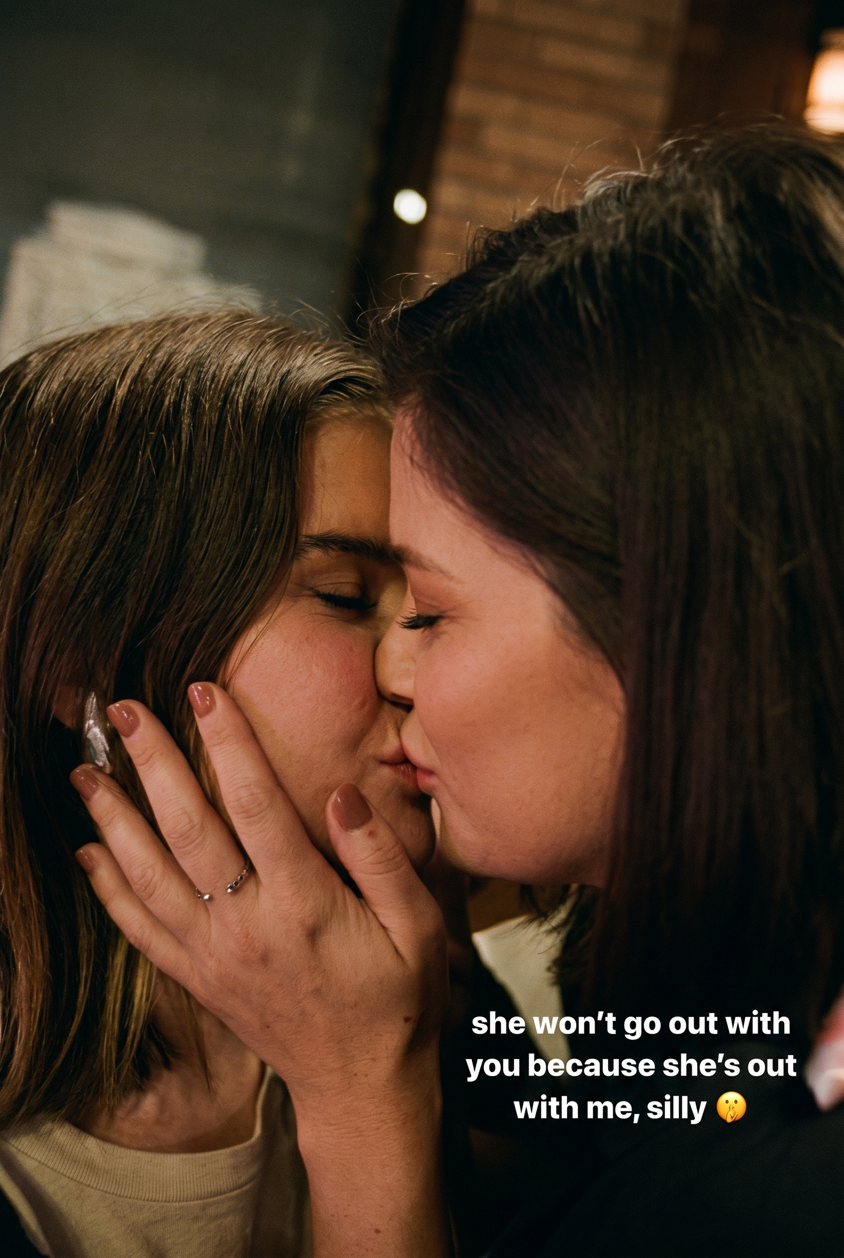 Maren Morris and Cassadee Pope kissing in an Instagram photo