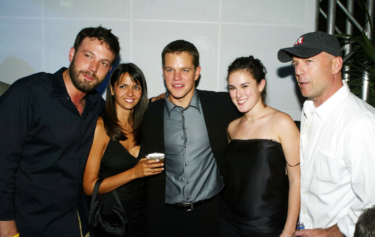 Matt Damon, Luciana Bozan, Bruce Willis, Rumer Willis, and Ben Affleck posing together at The Bourne Supremacy after party in Los Angeles, 2004
