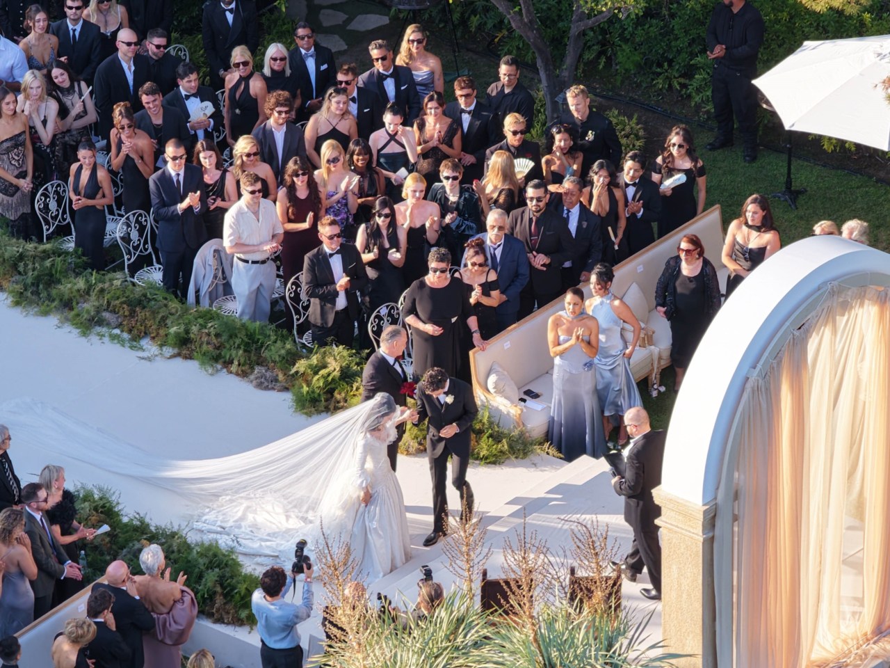 Aerial view of a Hollywood Hills estate decorated for Matty Healy and Gabbriette Bechtel's wedding, with the Hollywood Sign visible in the background.