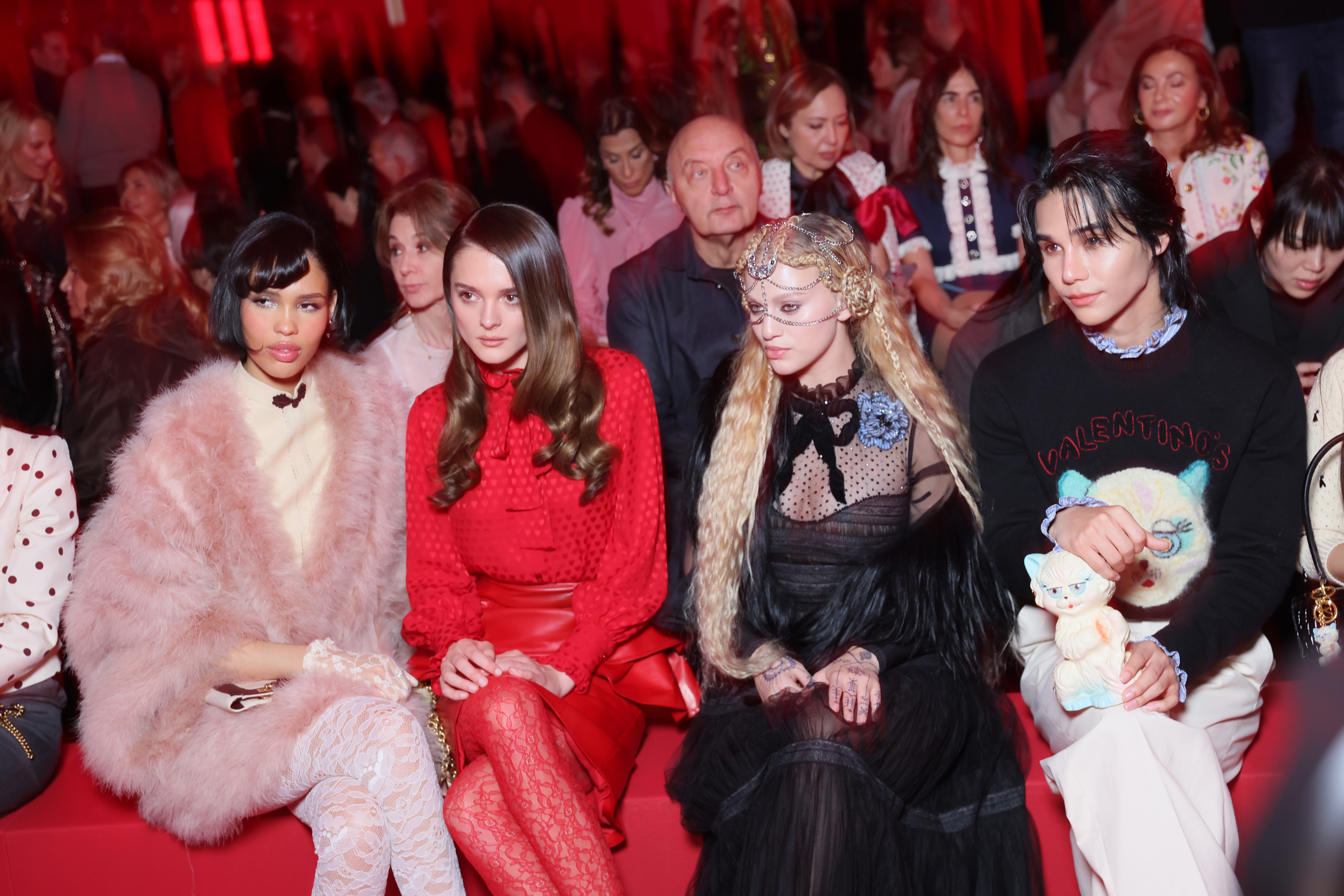 Nara Smith, Charlotte Lawrence, Elyanna Marjieh, and Jeff Satur sitting front row at the Valentino Paris Fashion Week show