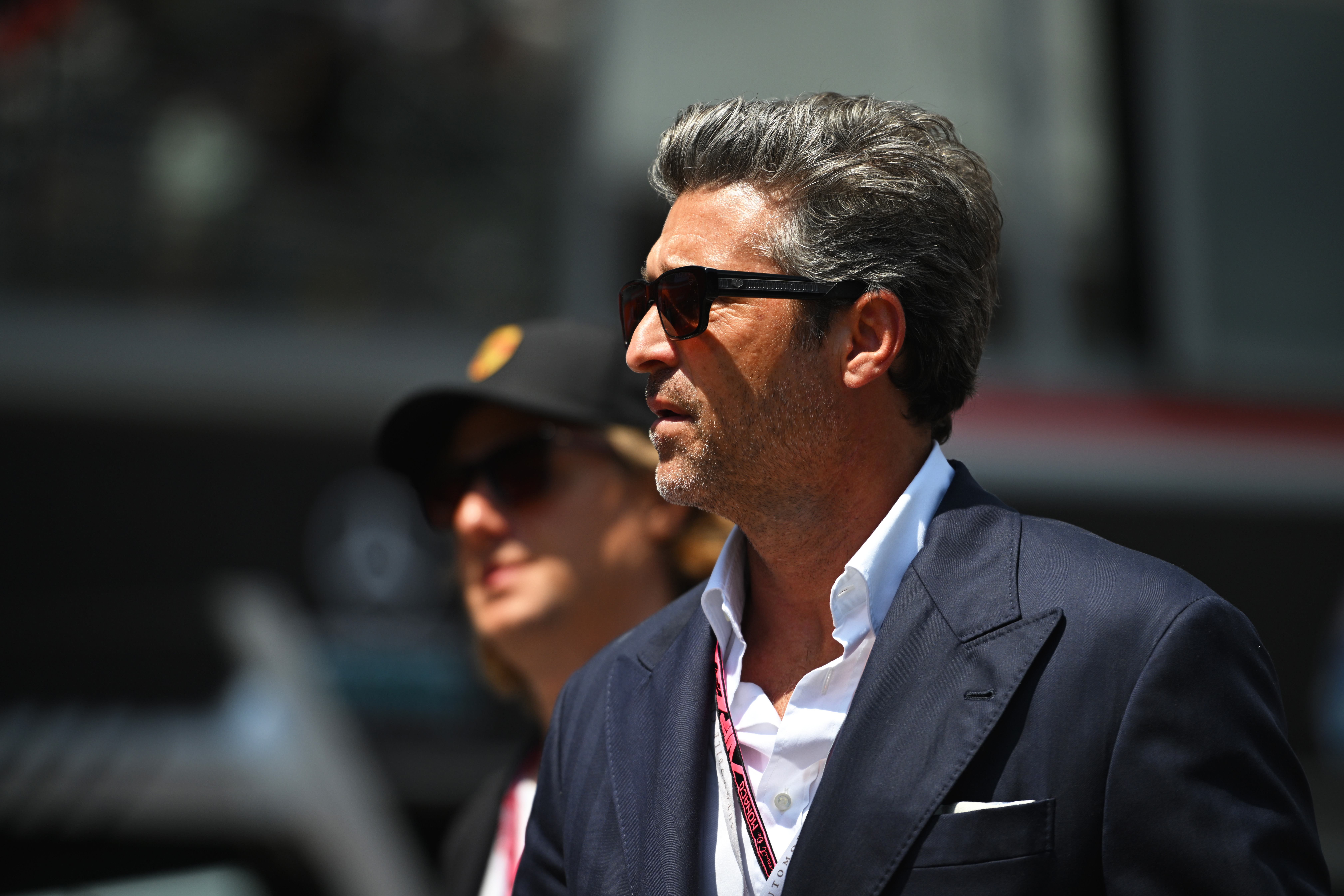 Patrick Dempsey standing in the paddock at the Circuit de Monaco before the F1 Grand Prix of Monaco
