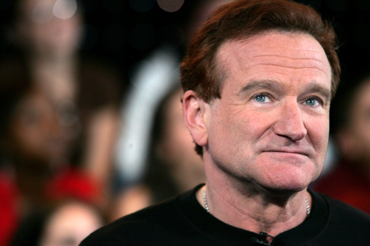 Robin Williams performing onstage at MTV's Total Request Live at Times Square Studios in New York City