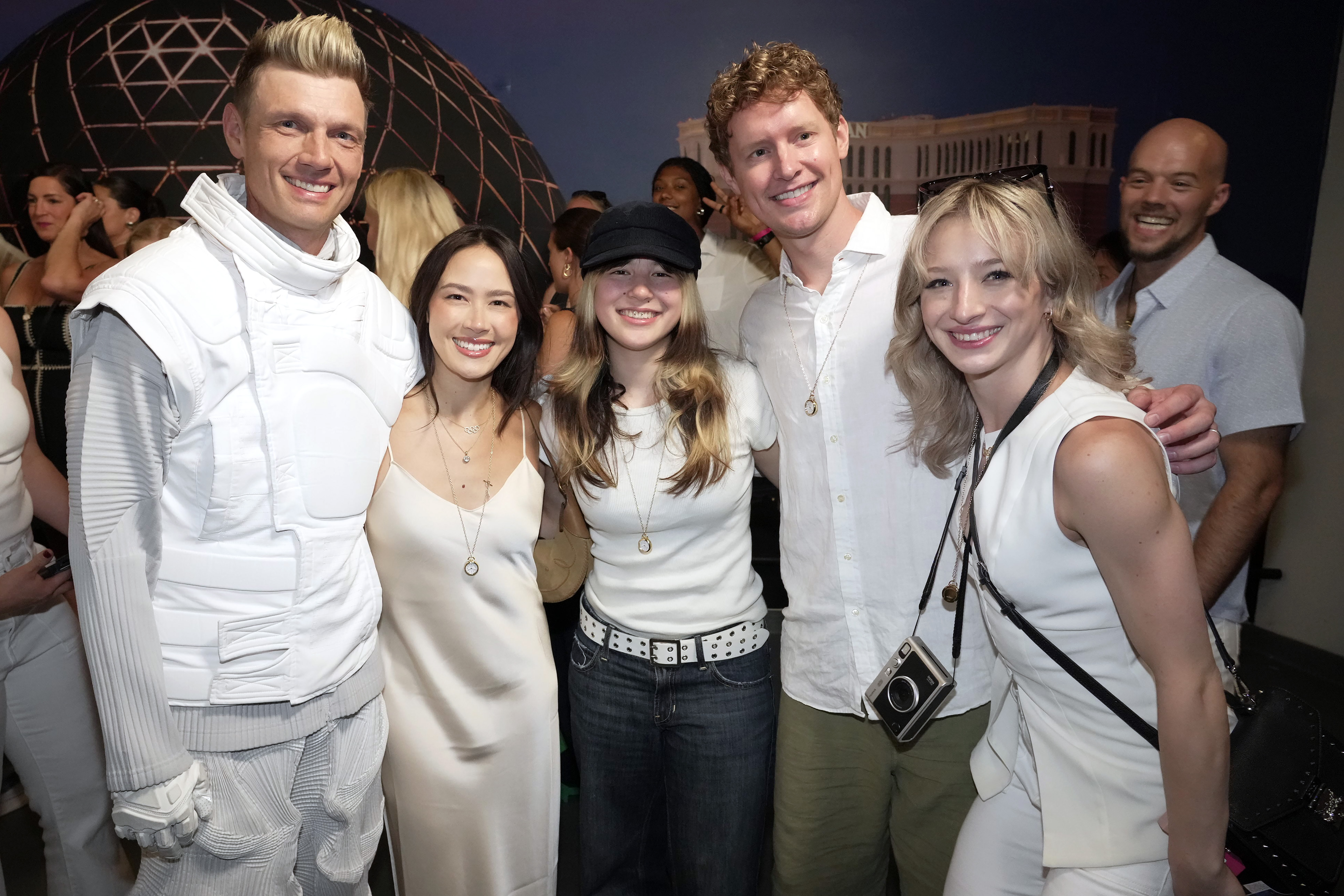 Nick Carter, Madison Chock, Alysa Liu, Evan Bates, and Amber Glenn pose together at a Team USA meet-and-greet at the Sphere in Las Vegas
