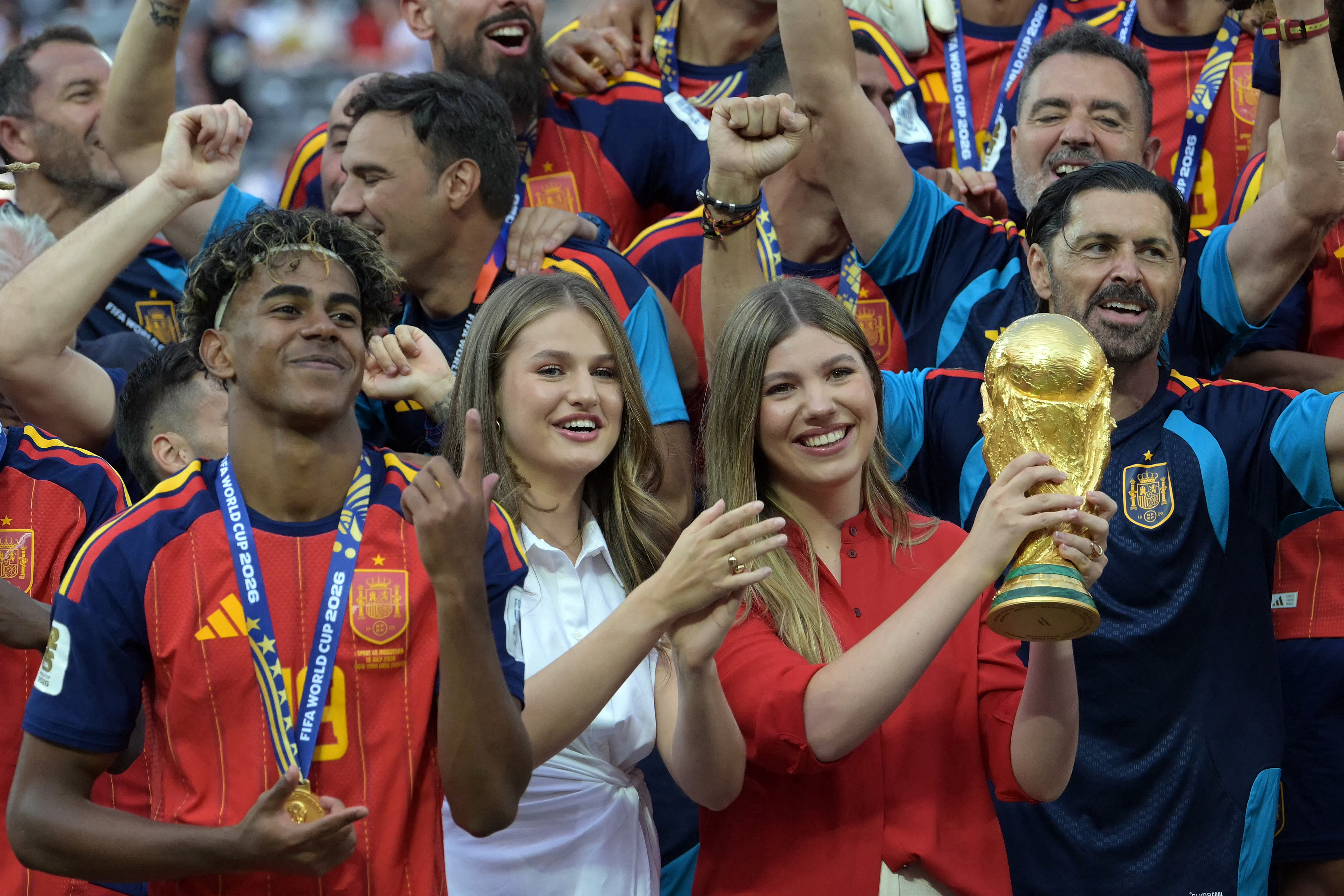 Princess Leonor and Princess Sofia lifting the FIFA World Cup trophy with Spain's Lamine Yamal after the 2026 final against Argentina