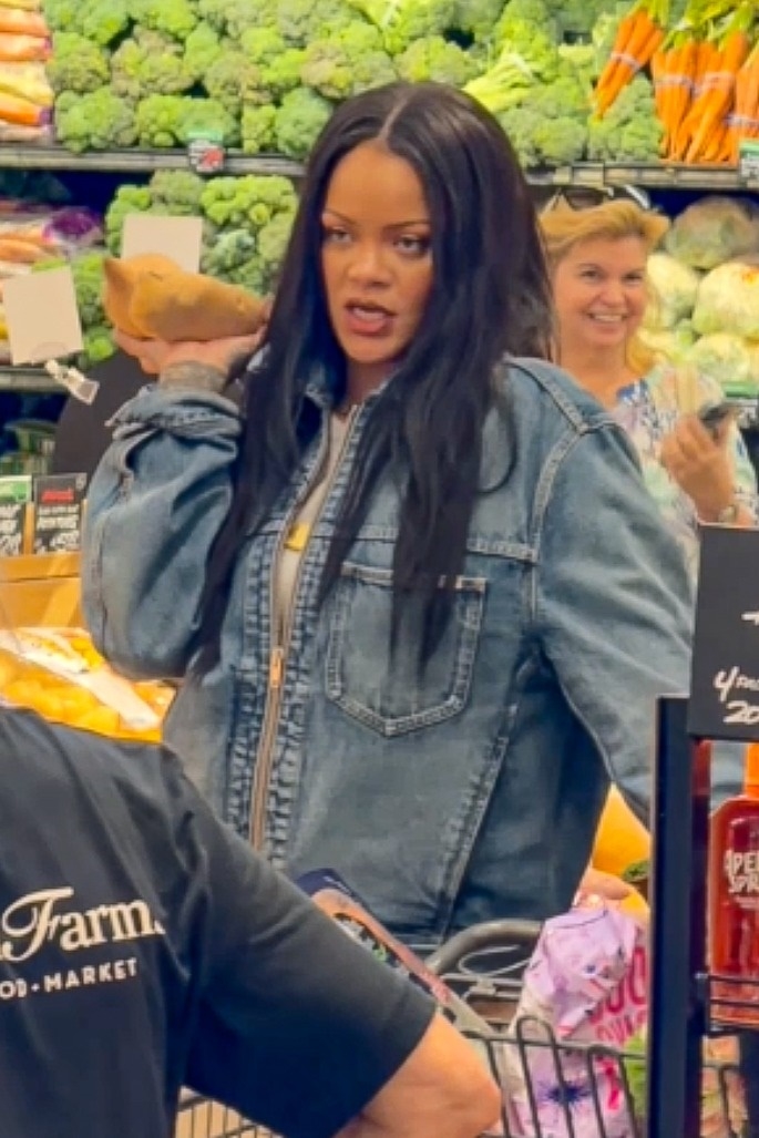 Rihanna shopping in the produce section of Bristol Farms grocery store, holding avocados