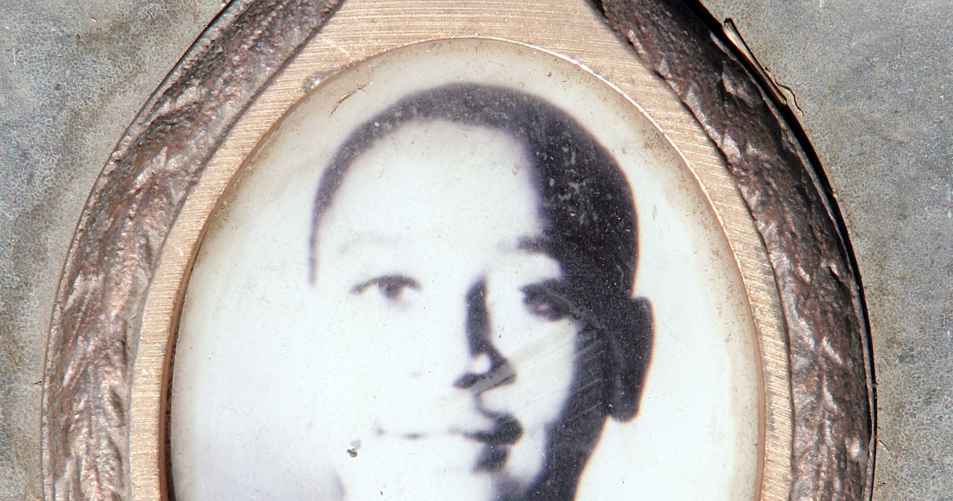 A plaque with a photo of Emmett Till at his gravesite at Burr Oak Cemetery in Alsip, Illinois