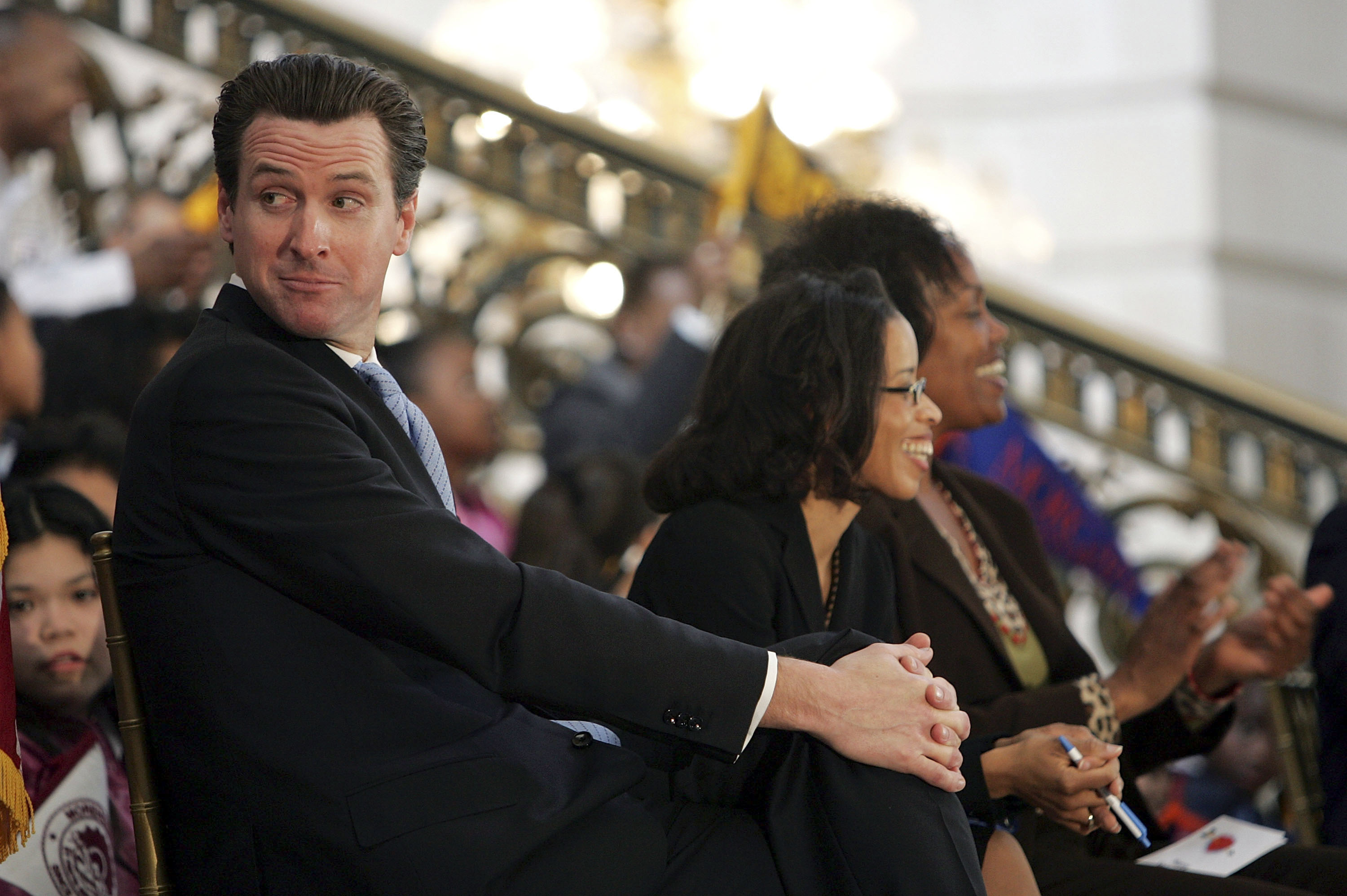 Gavin Newsom looking over his shoulder at a Black History Month event in San Francisco in 2007