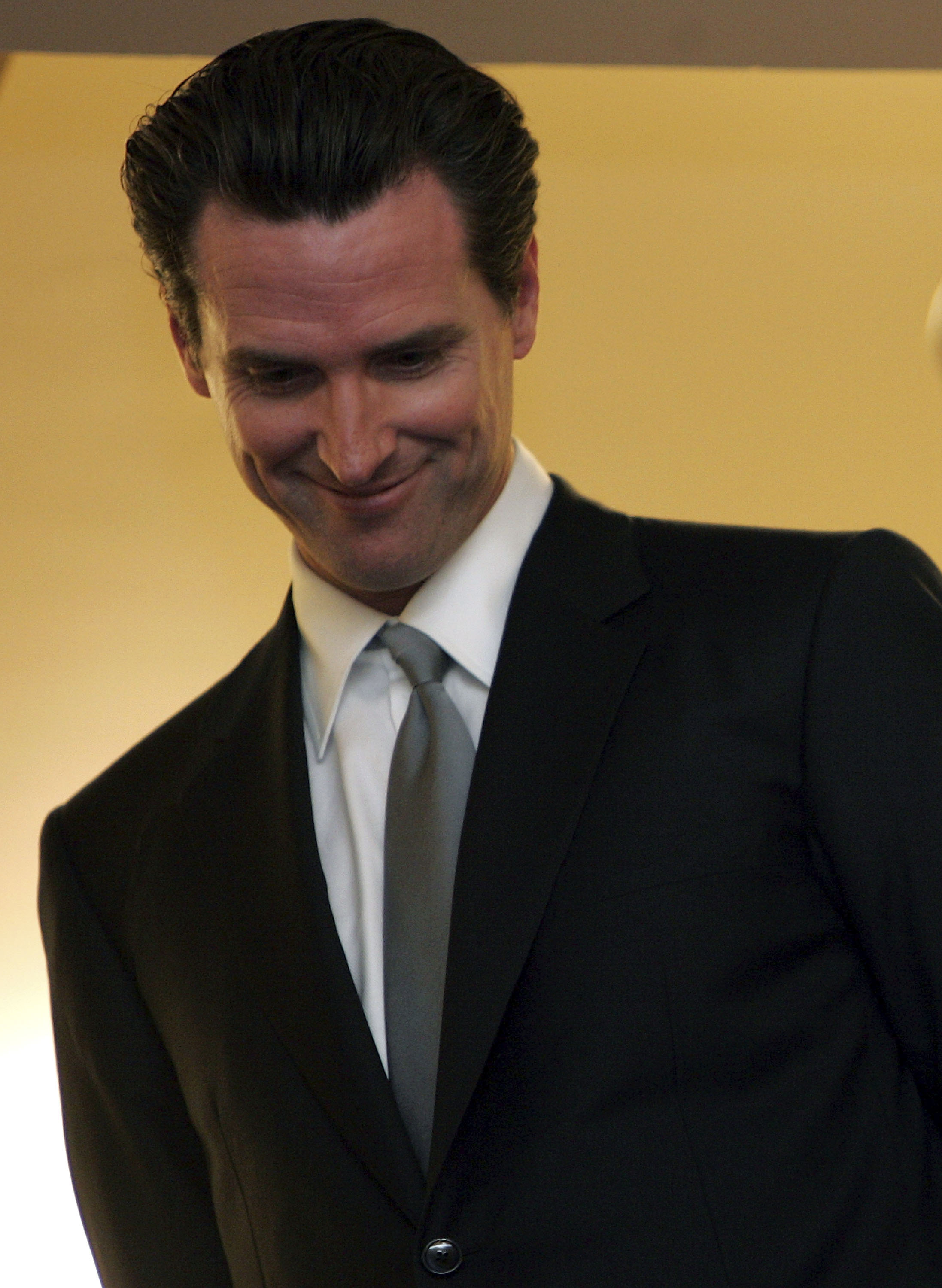Gavin Newsom smiling at a swearing-in ceremony in San Francisco, February 2007