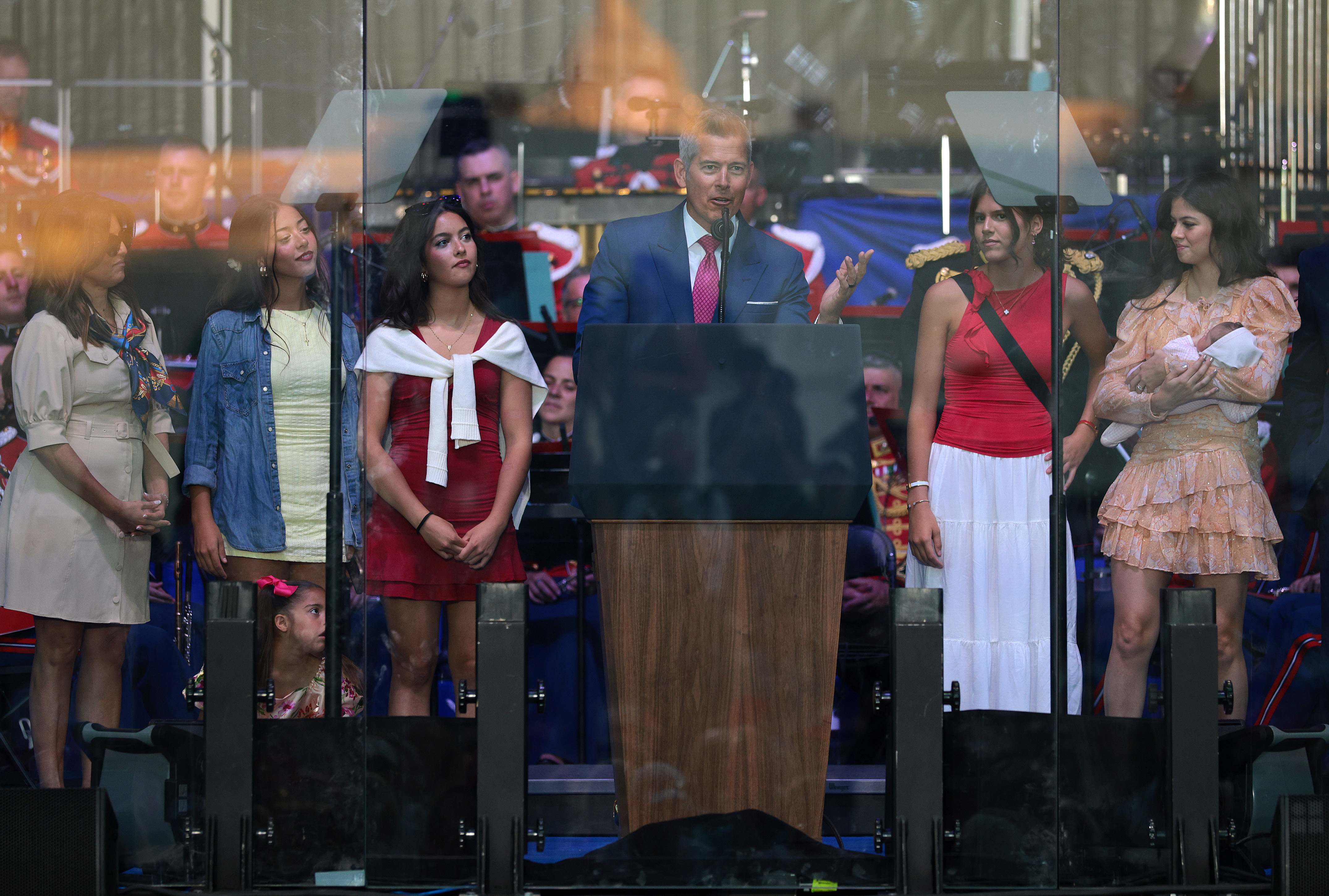 Sean Duffy speaking at a rally on the National Mall in Washington, D.C., with his family beside him on stage