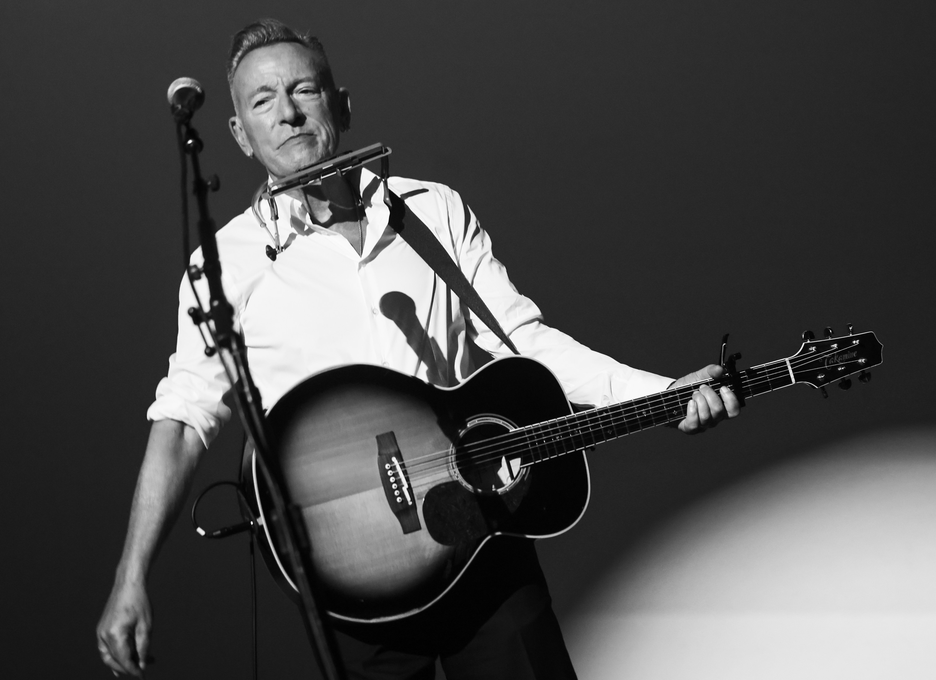 Bruce Springsteen performing on stage at the AFI FEST 2025 premiere of "Springsteen: Deliver Me From Nowhere" at TCL Chinese Theatre in Hollywood