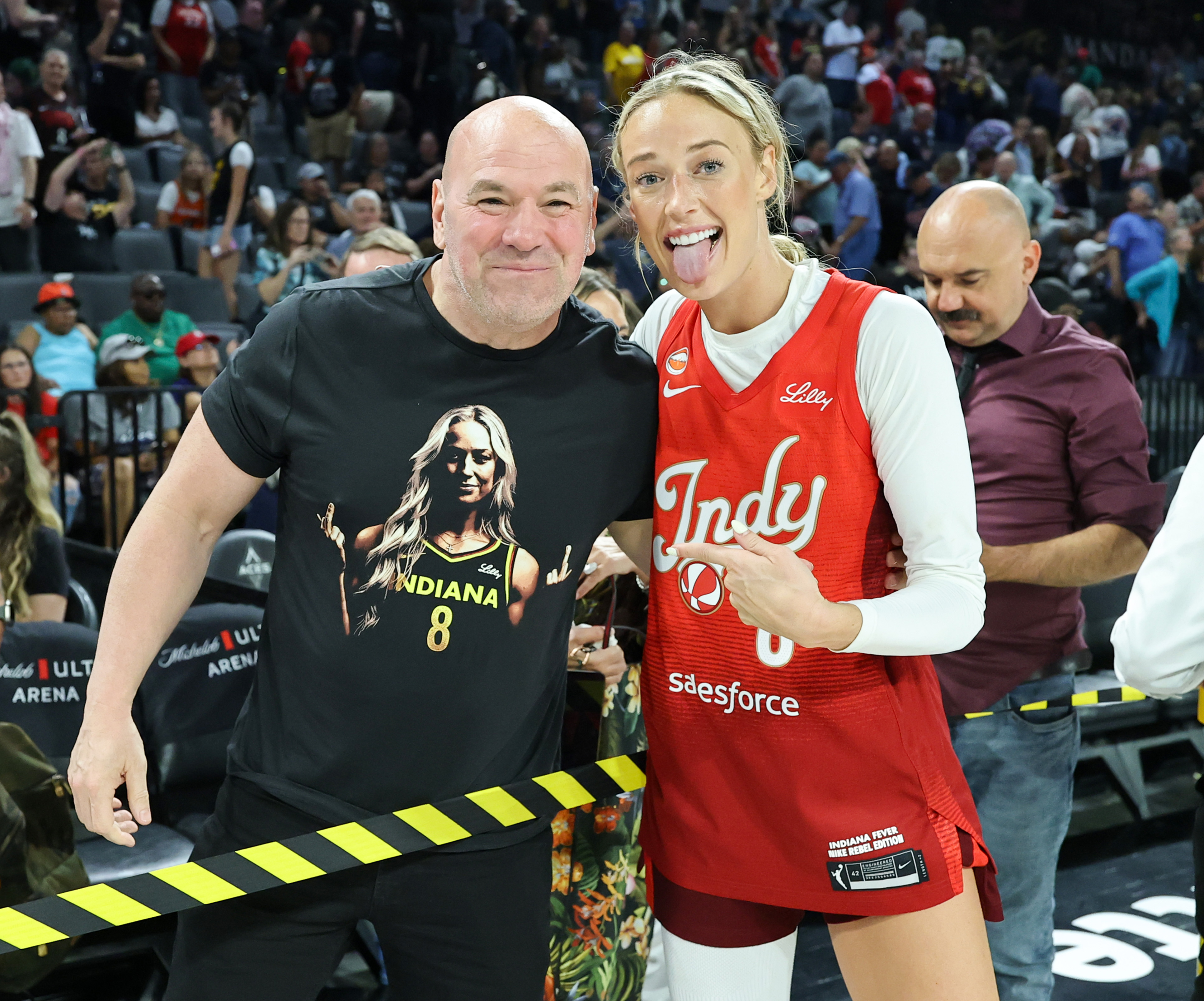 Dana White wearing a Sophie Cunningham T-shirt posing with Sophie Cunningham after an Indiana Fever game in Las Vegas