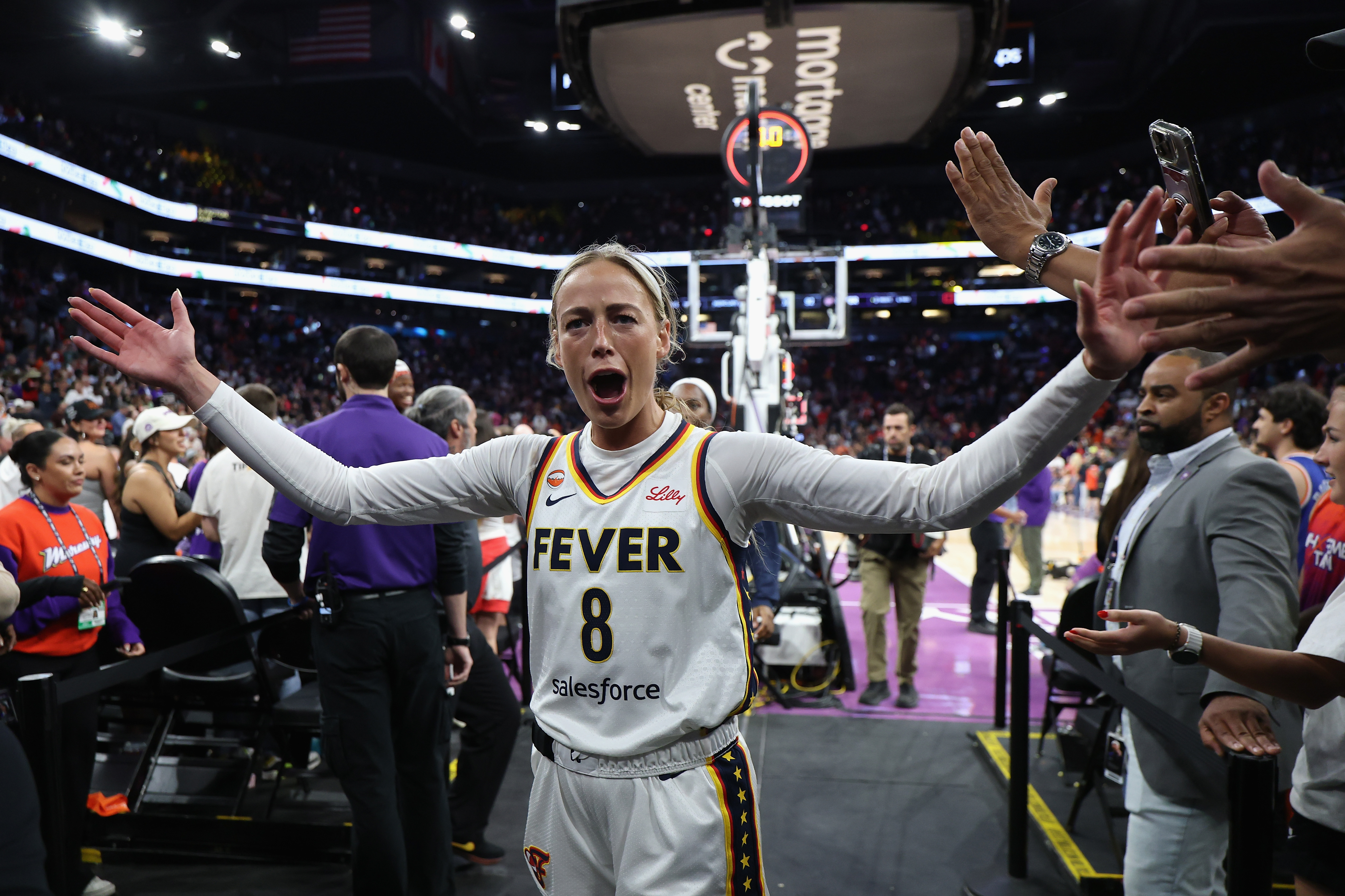 Sophie Cunningham in an Indiana Fever jersey reacting on the court after a win over the Phoenix Mercury