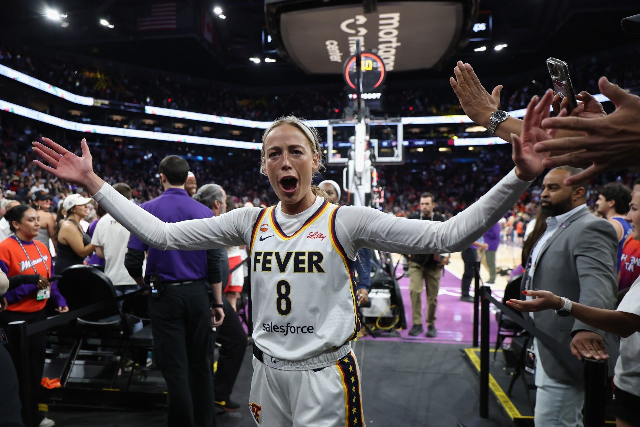 Sophie Cunningham in an Indiana Fever jersey reacting on the court after a win over the Phoenix Mercury