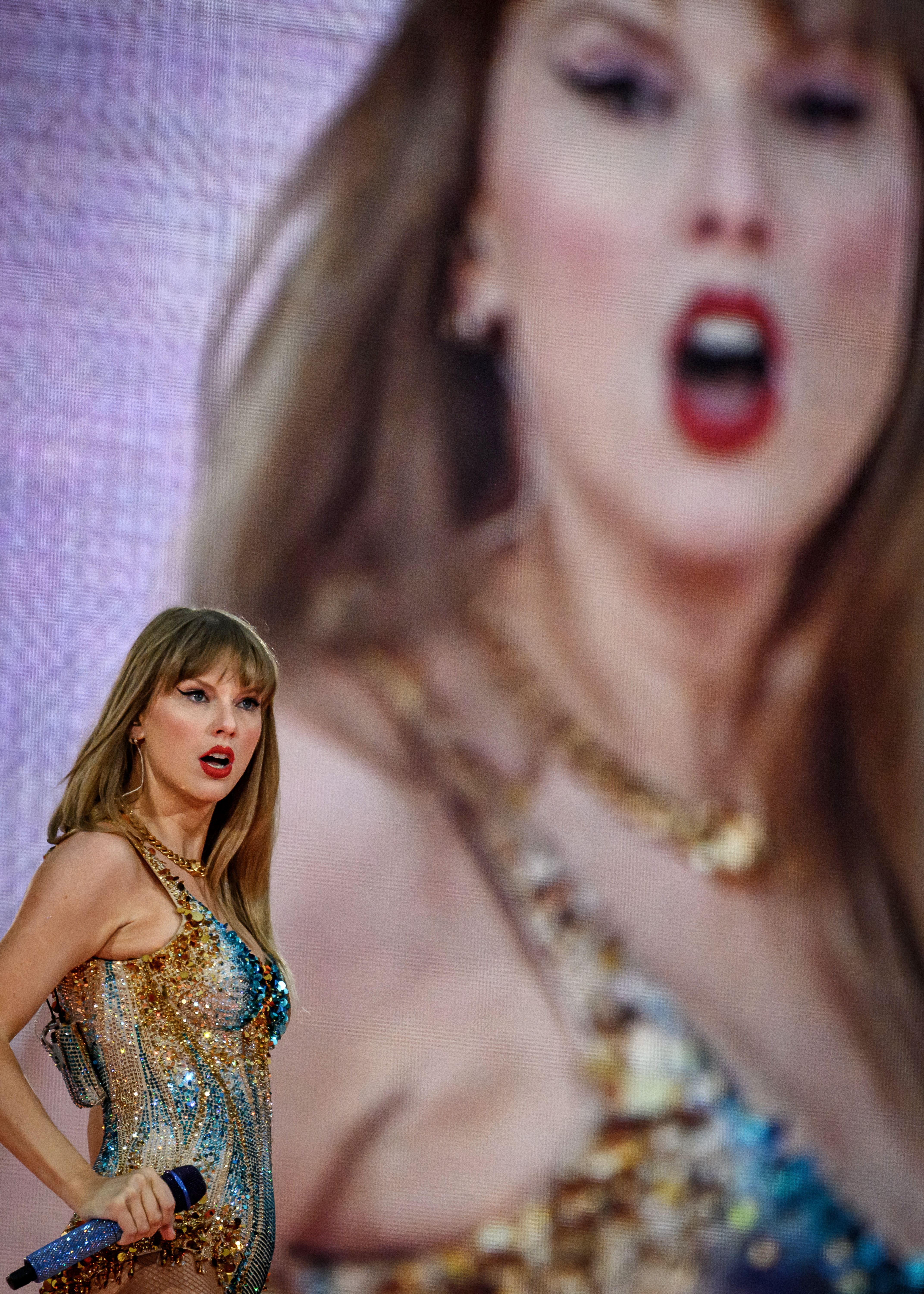 Taylor Swift performing on stage at Groupama Stadium in France during the Eras Tour