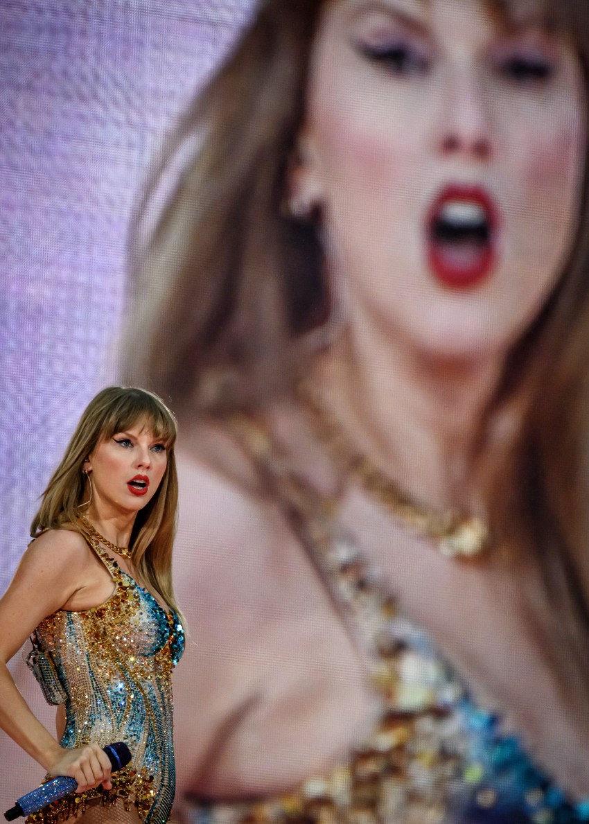 Taylor Swift performing on stage at Groupama Stadium in France during the Eras Tour