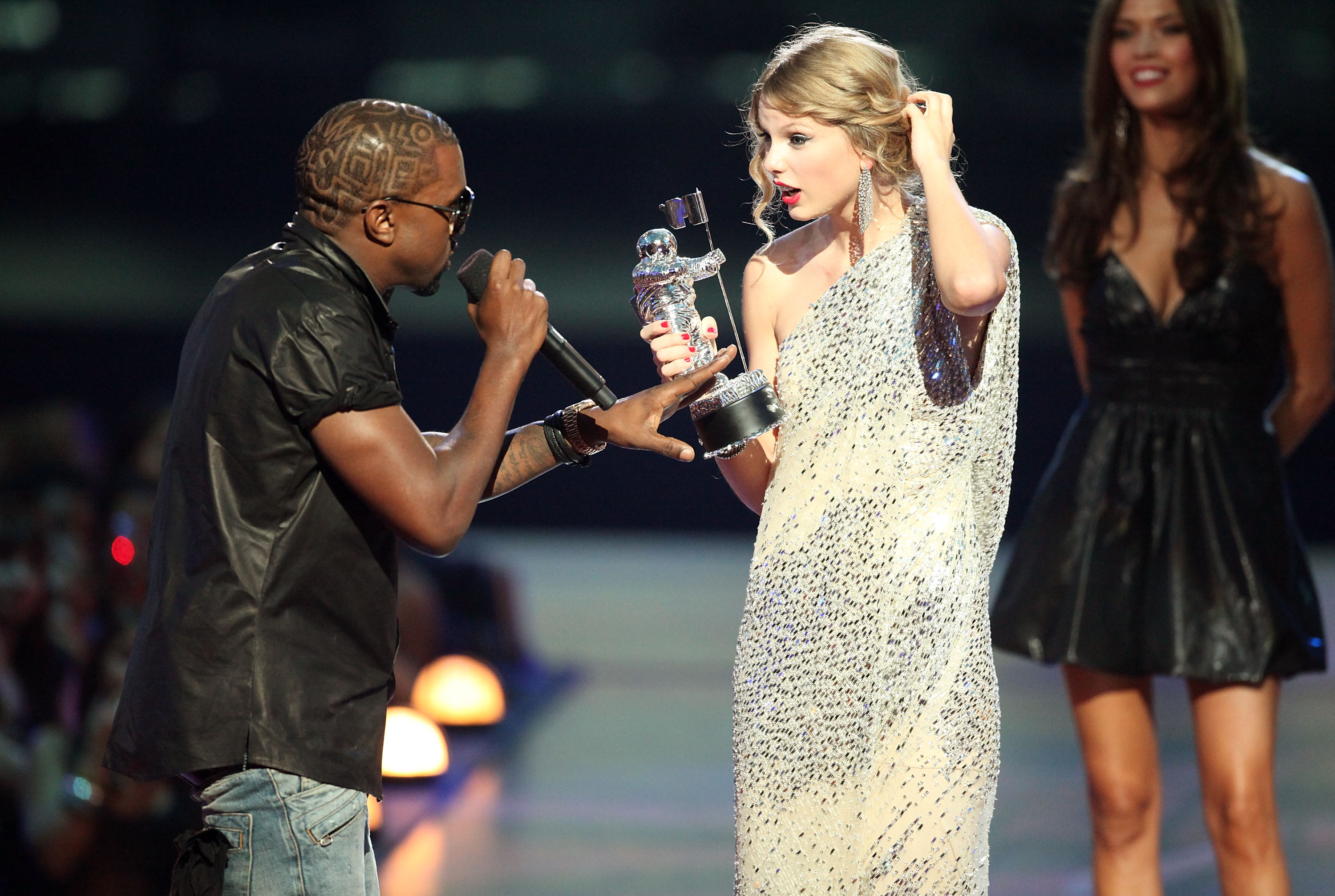 Kanye West jumping onstage next to Taylor Swift at the 2009 MTV Video Music Awards at Radio City Music Hall