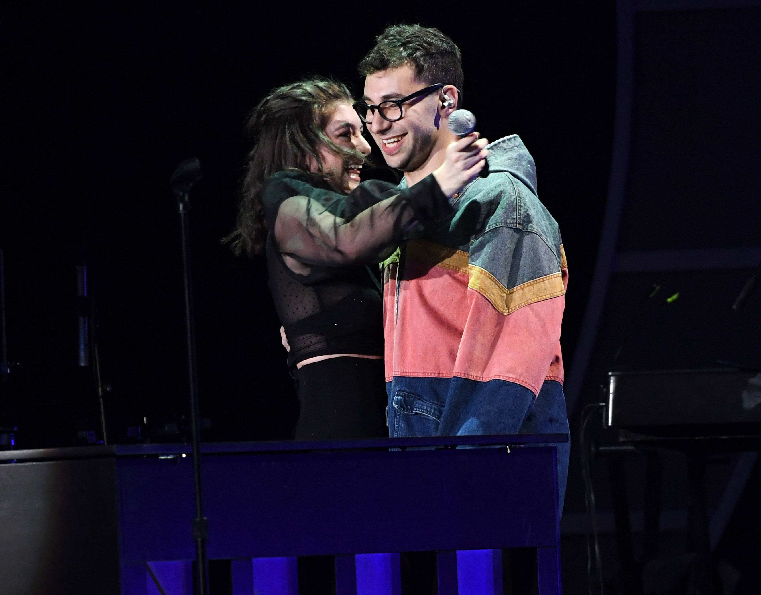 Lorde and Jack Antonoff hugging and smiling on stage at the 2017 iHeartRadio Music Festival, Las Vegas.