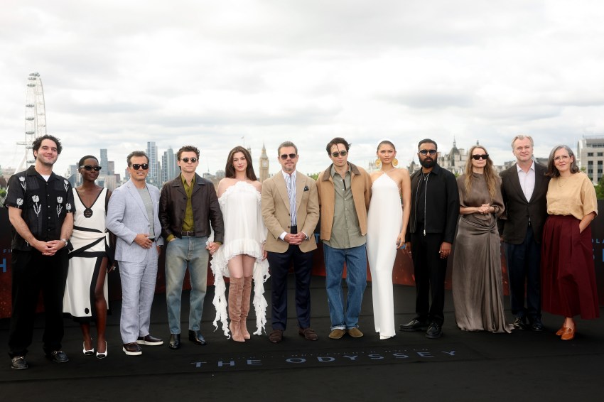 Christopher Nolan and the ensemble cast of The Odyssey posing together at a photocall at the IET Building in London