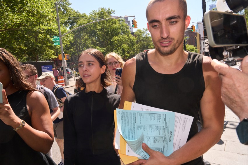 Angela Nikolau and Ivan Beerkus walking out of New York City Criminal Court after their arraignment