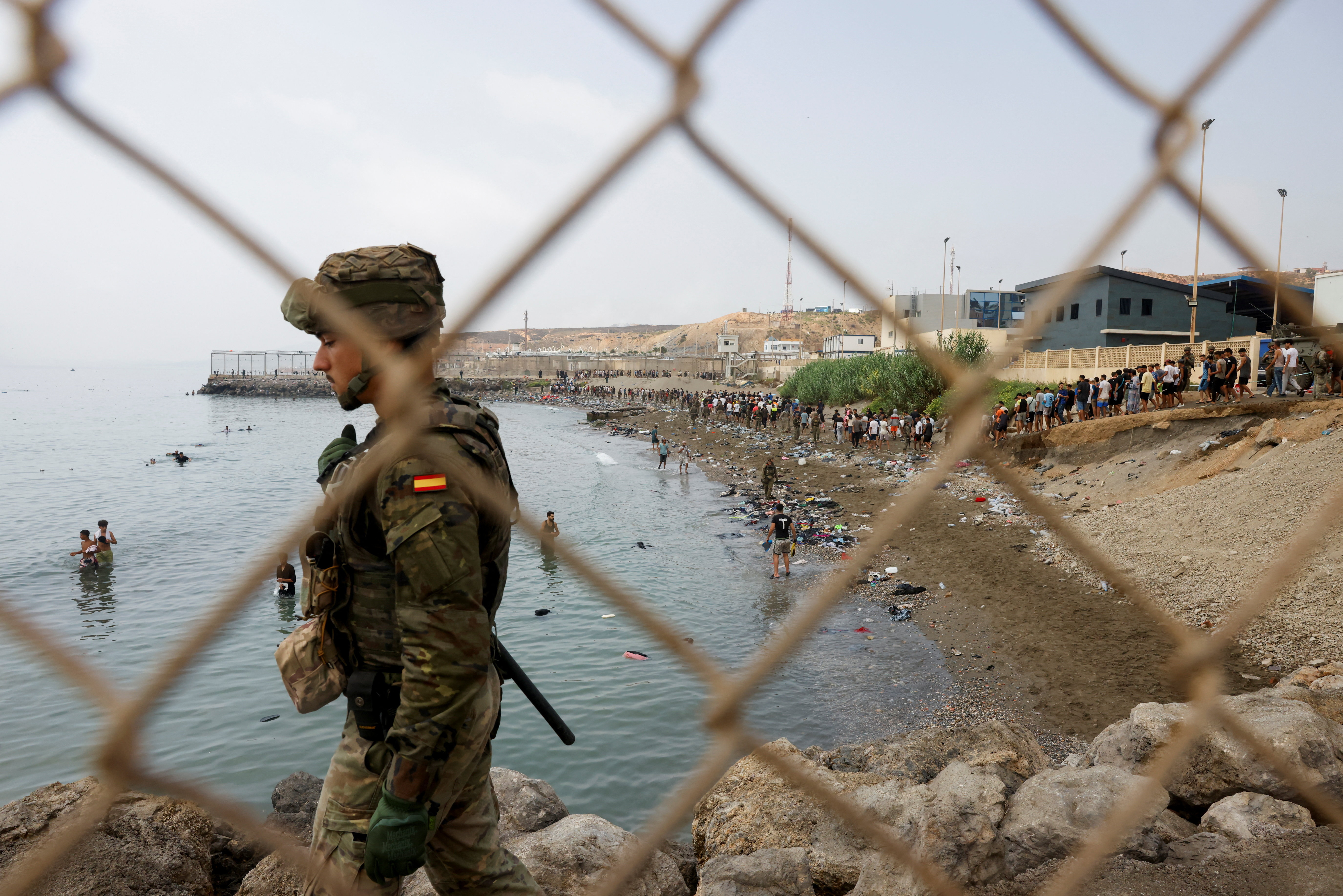 Migrants cross into the Spanish enclave of Ceuta