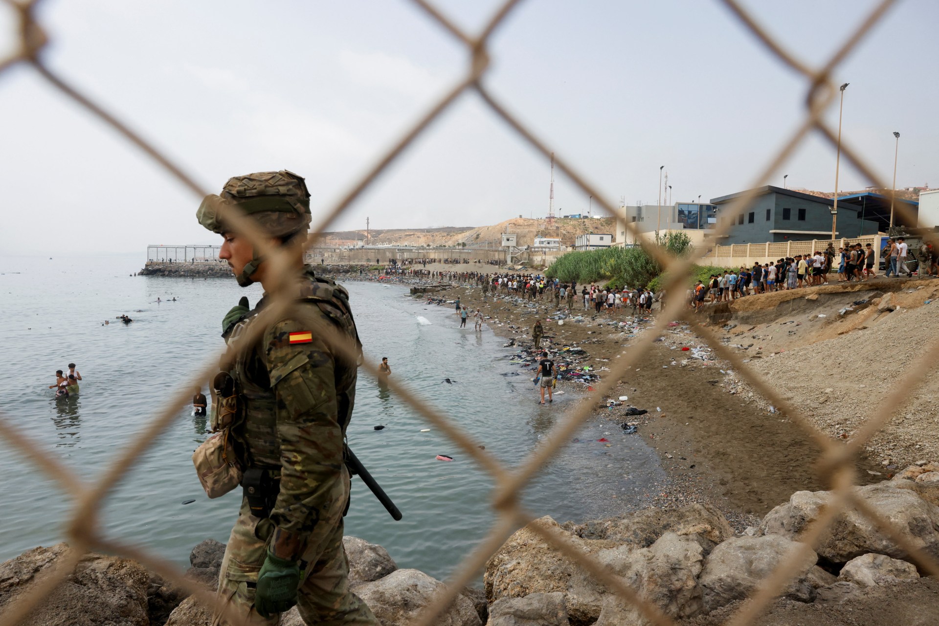 Migrants cross into the Spanish enclave of Ceuta