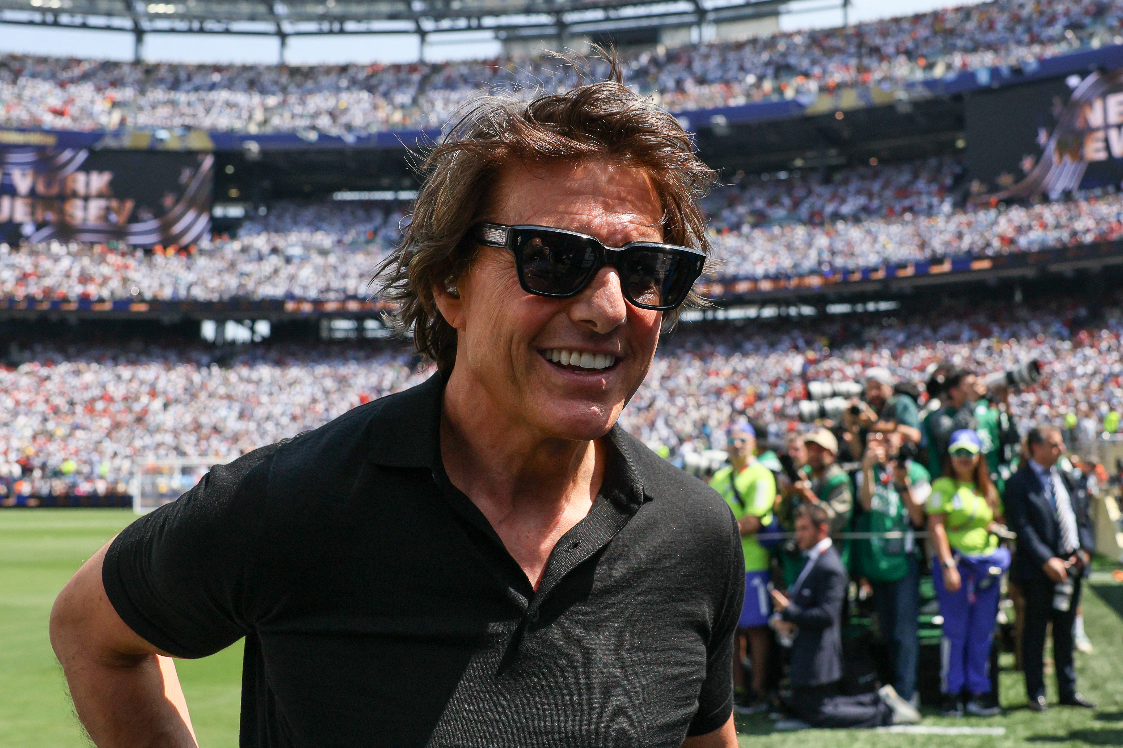 Click to open the image gallery Tom Cruise walking off the pitch at the New York/New Jersey Stadium before the 2026 World Cup final between Spain and Argentina