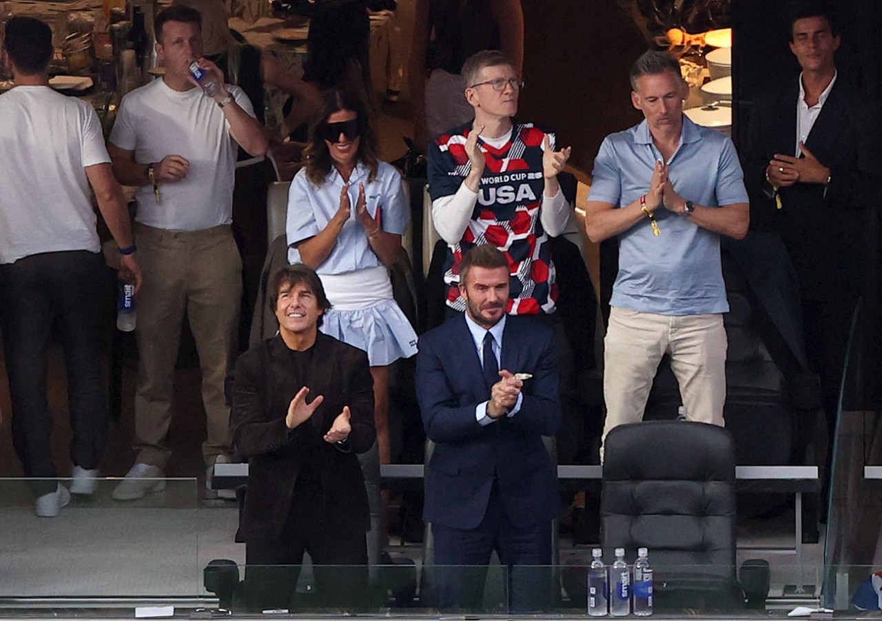 Tom Cruise and David Beckham reacting in the stands during the 2026 World Cup match between USA and Paraguay at Los Angeles Stadium