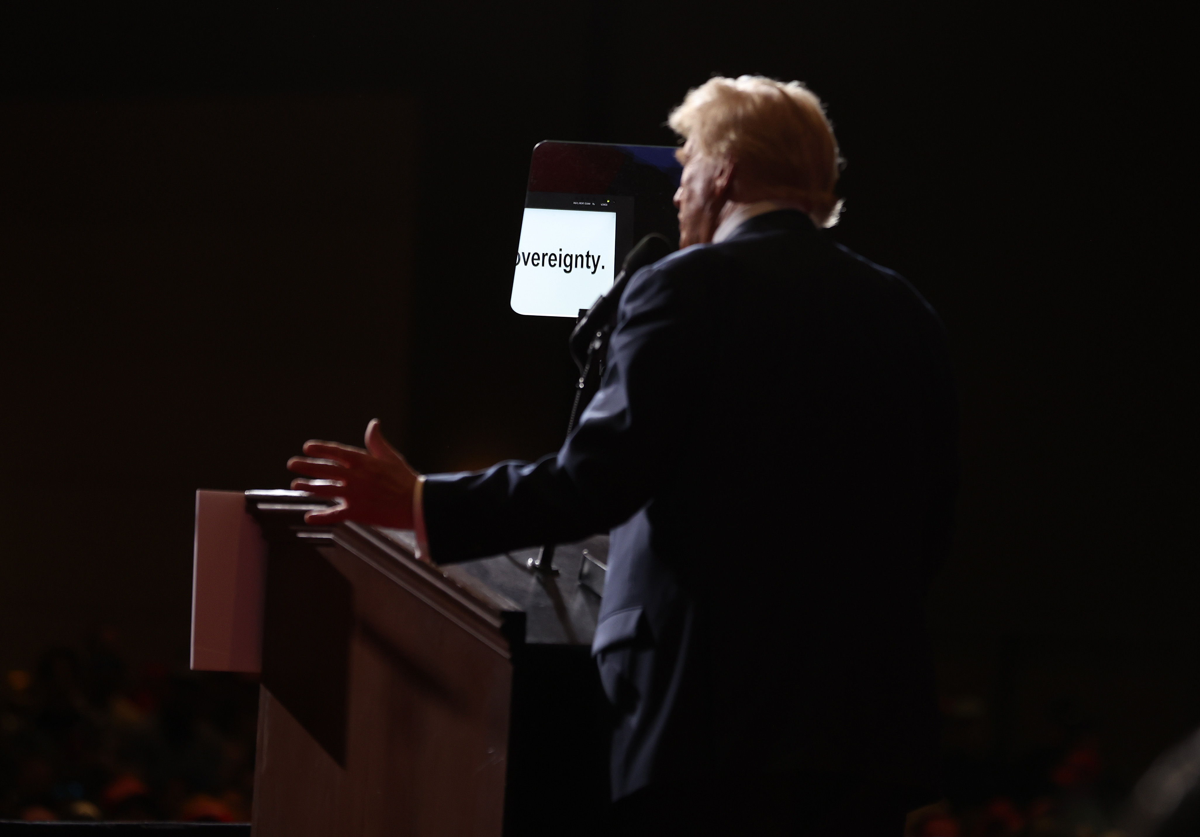 Donald Trump speaking at a campaign rally in Reno, Nevada with a teleprompter visible in front of him