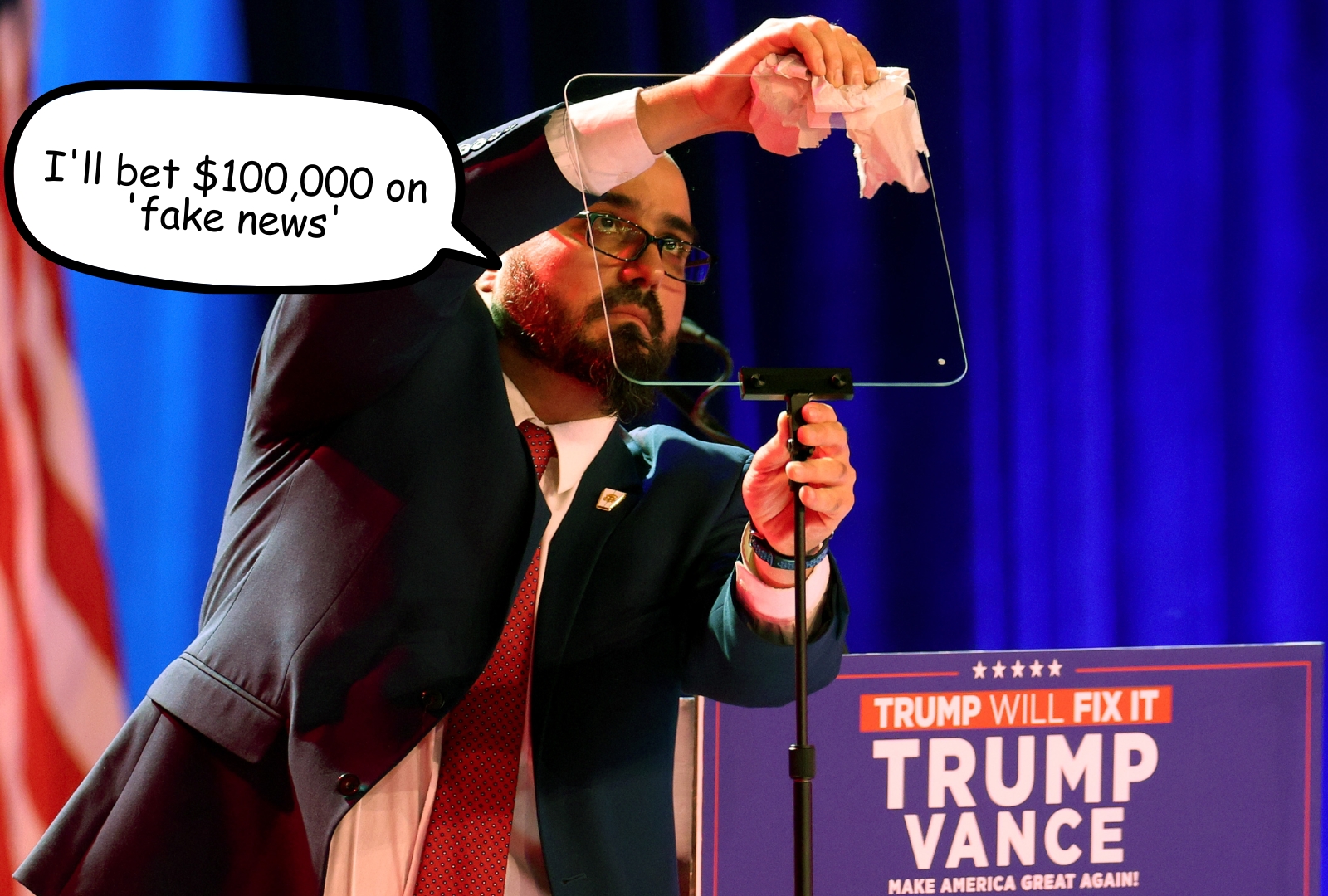 Man in a black suit adjusting a transparent teleprompter panel at a podium with the Presidential Seal, with American flags in the background.