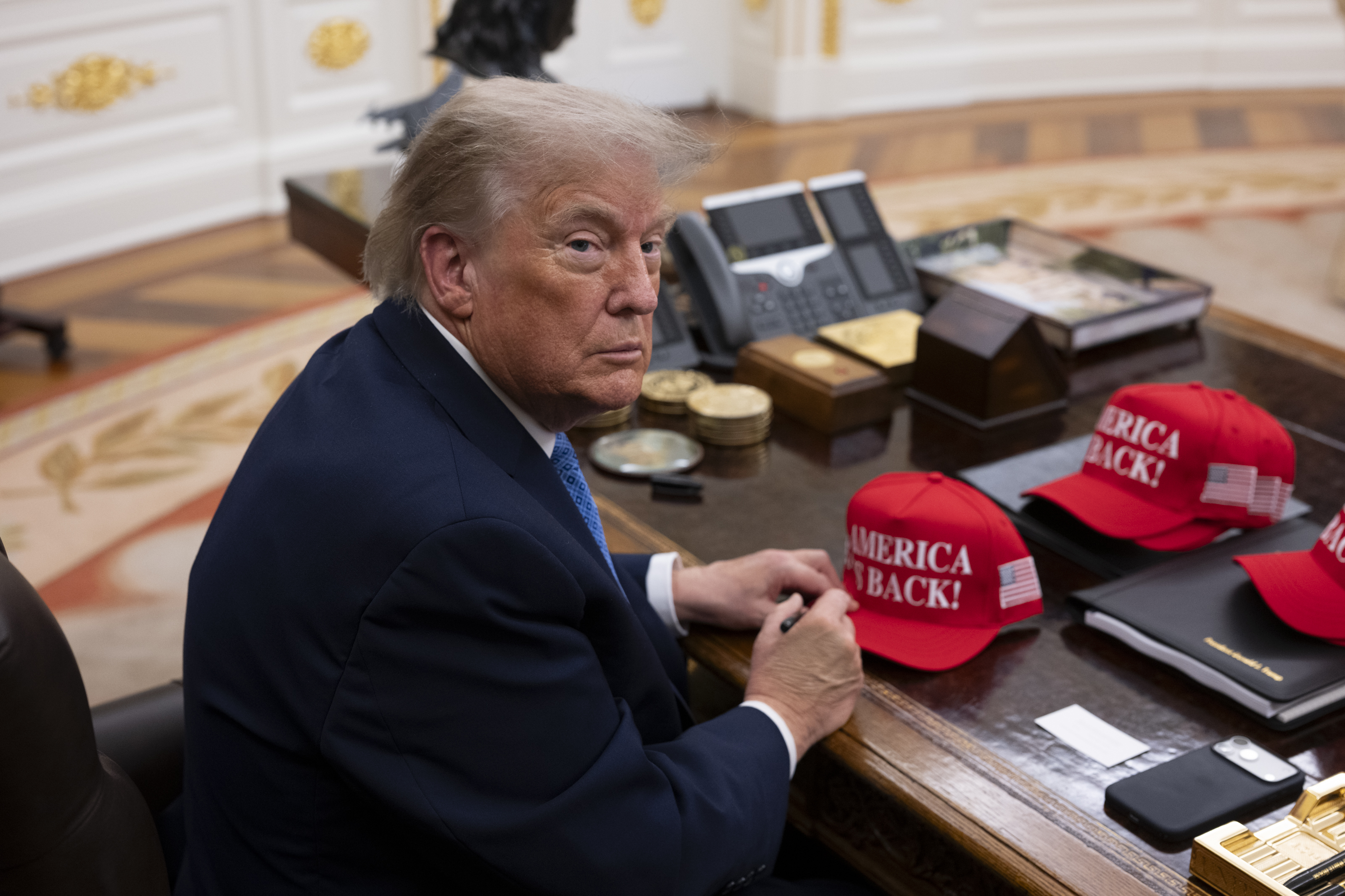 President Donald Trump speaking to the press in the Oval Office