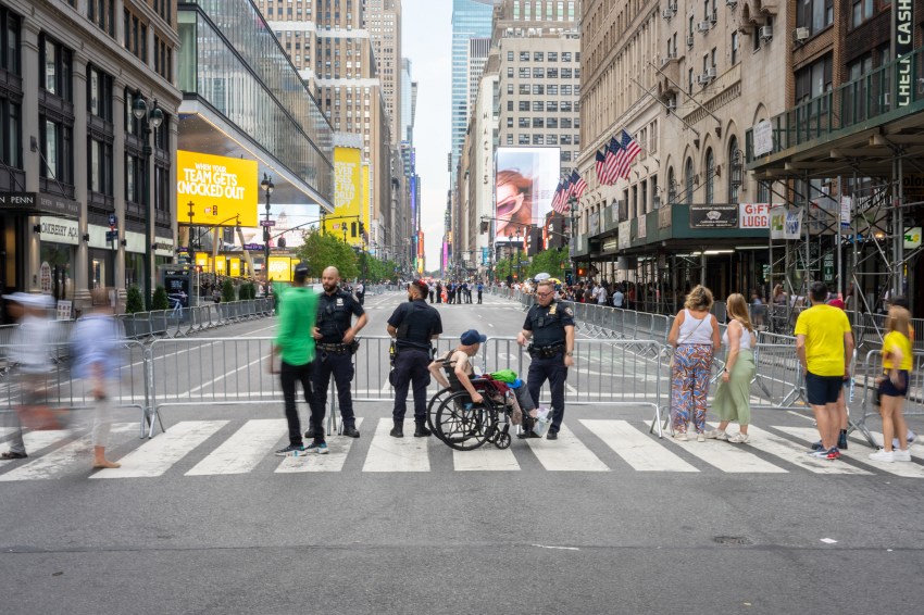 Police officers directing pedestrians amid street closures near Madison Square Garden in New York City