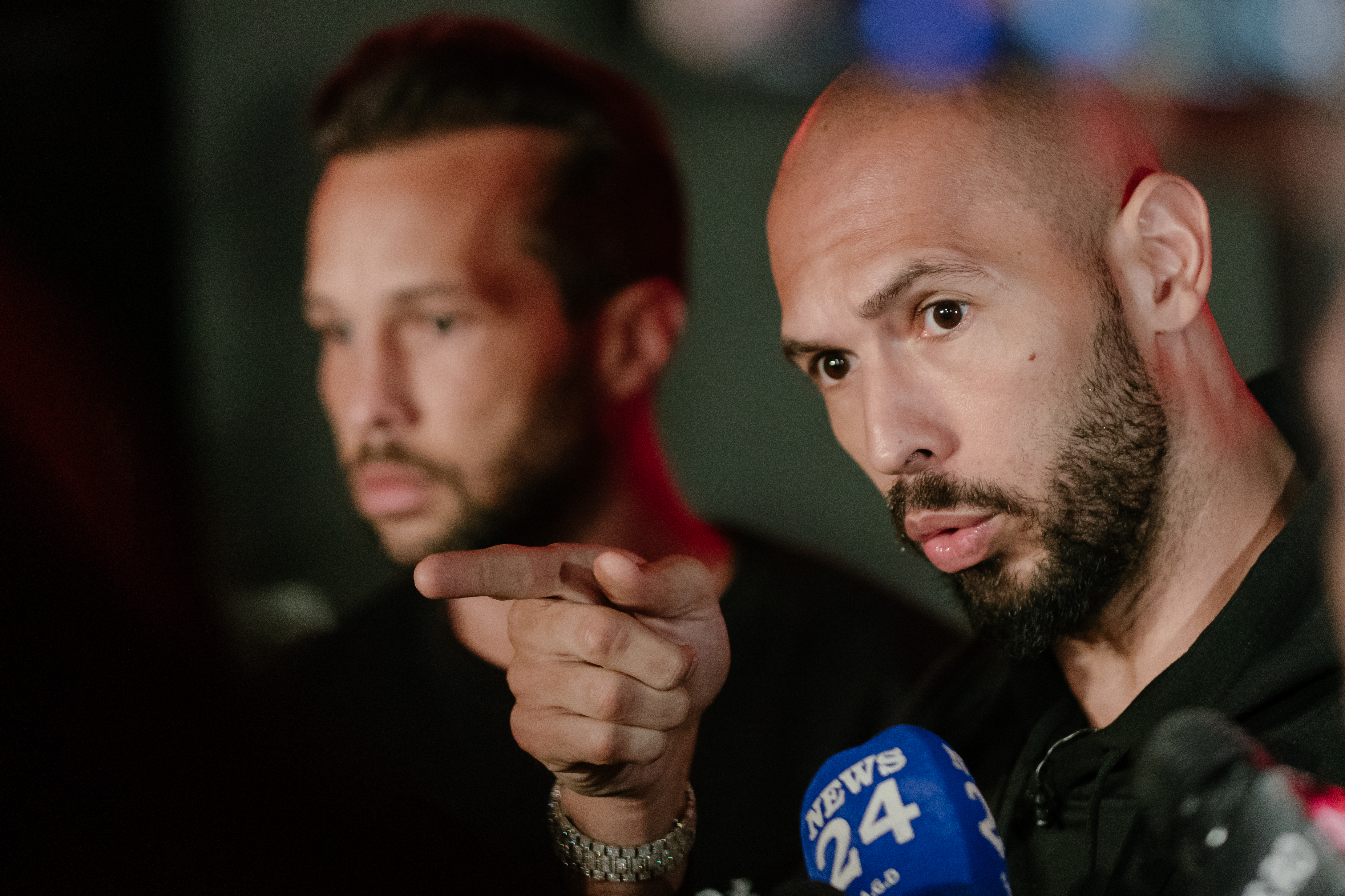 Andrew Tate and Tristan Tate speaking to media outside their residence in Bucharest, Romania