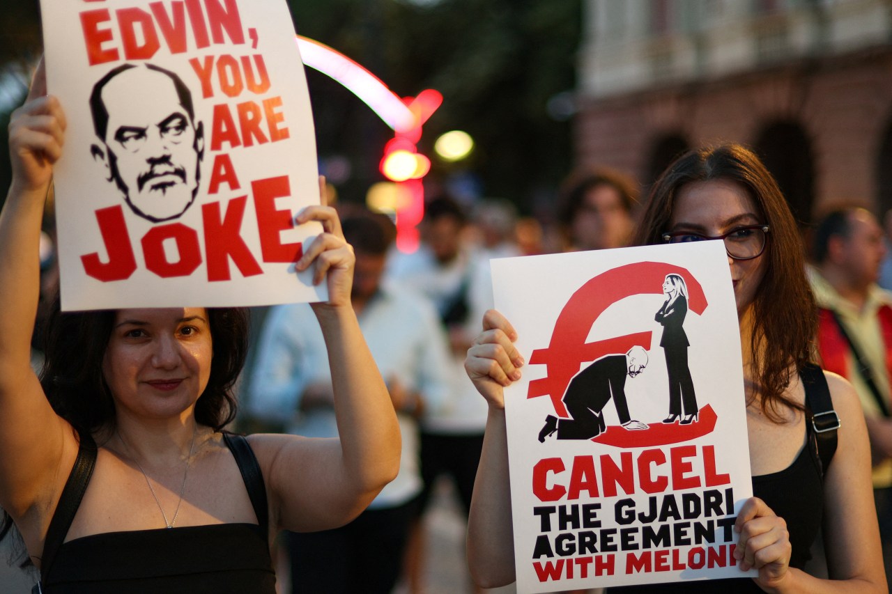 Protesters holding placards in Tirana, Albania, demonstrating against a planned luxury resort linked to Jared Kushner