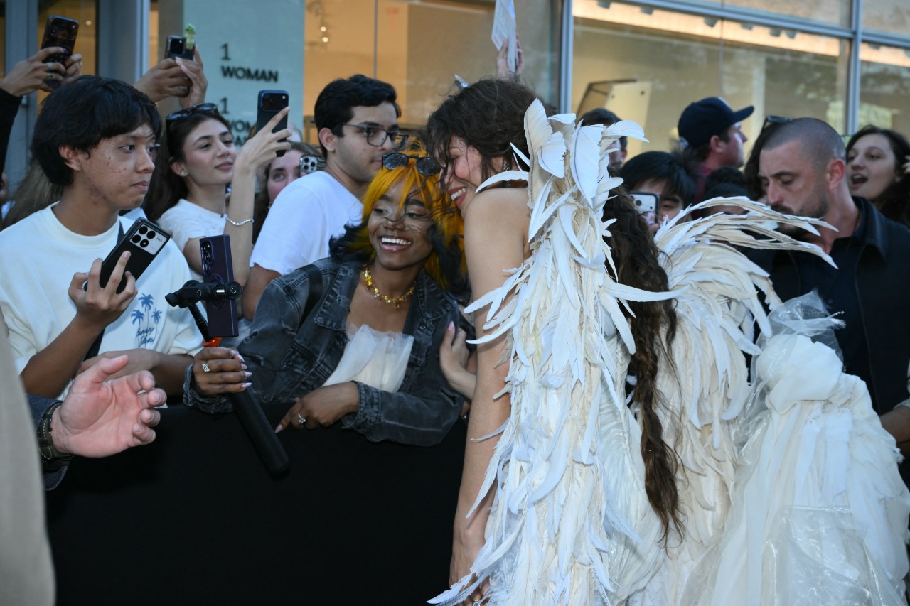 Zendaya taking selfies with fans at The Odyssey premiere at AMC Lincoln Square in New York