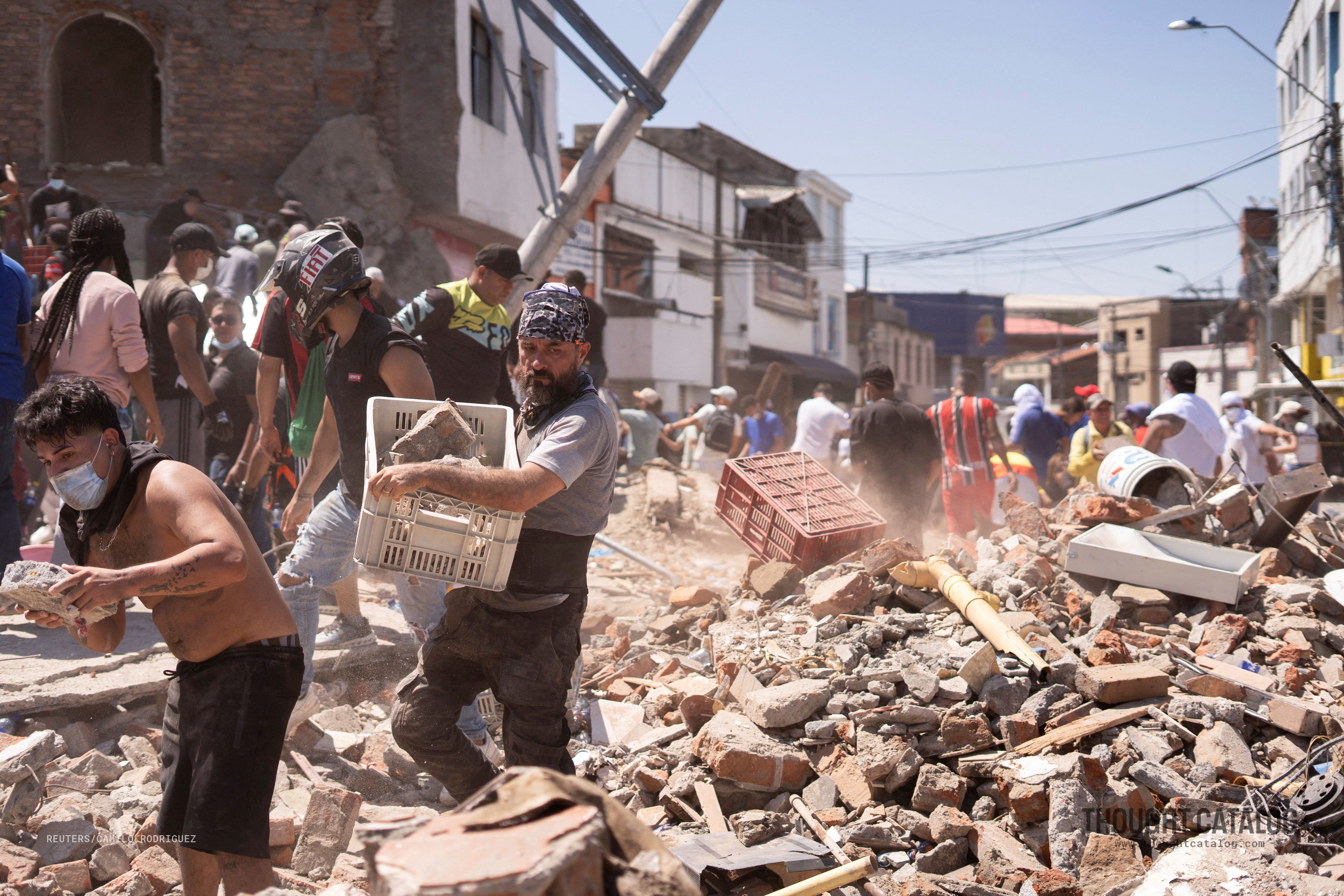Rescue workers at a collapsed building following a major earthquake in western Colombia