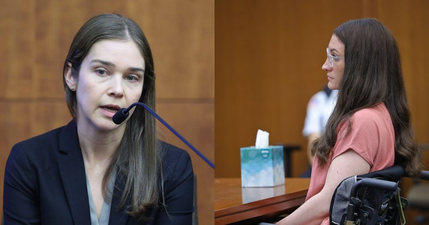 Woman with long brown hair in a black blazer speaking into a microphone at a witness stand in a courtroom.