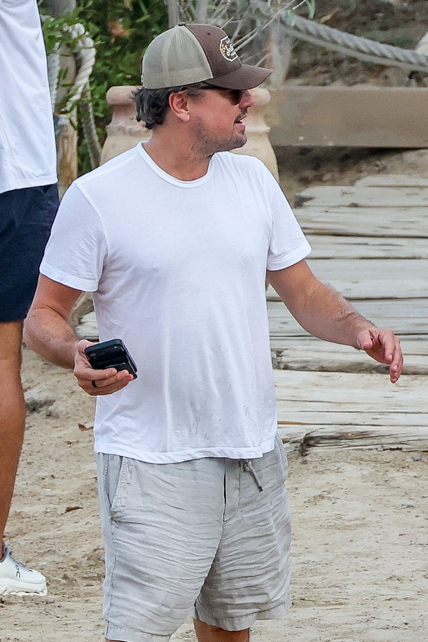 Leonardo DiCaprio and Vittoria Ceretti leaving El Chiringuito restaurant in Ibiza with friends