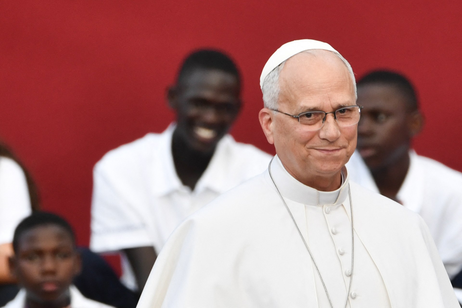 Pope Leo XIV smiling at a concert at Castel Gandolfo's Borgo Laudato Si' environmental center