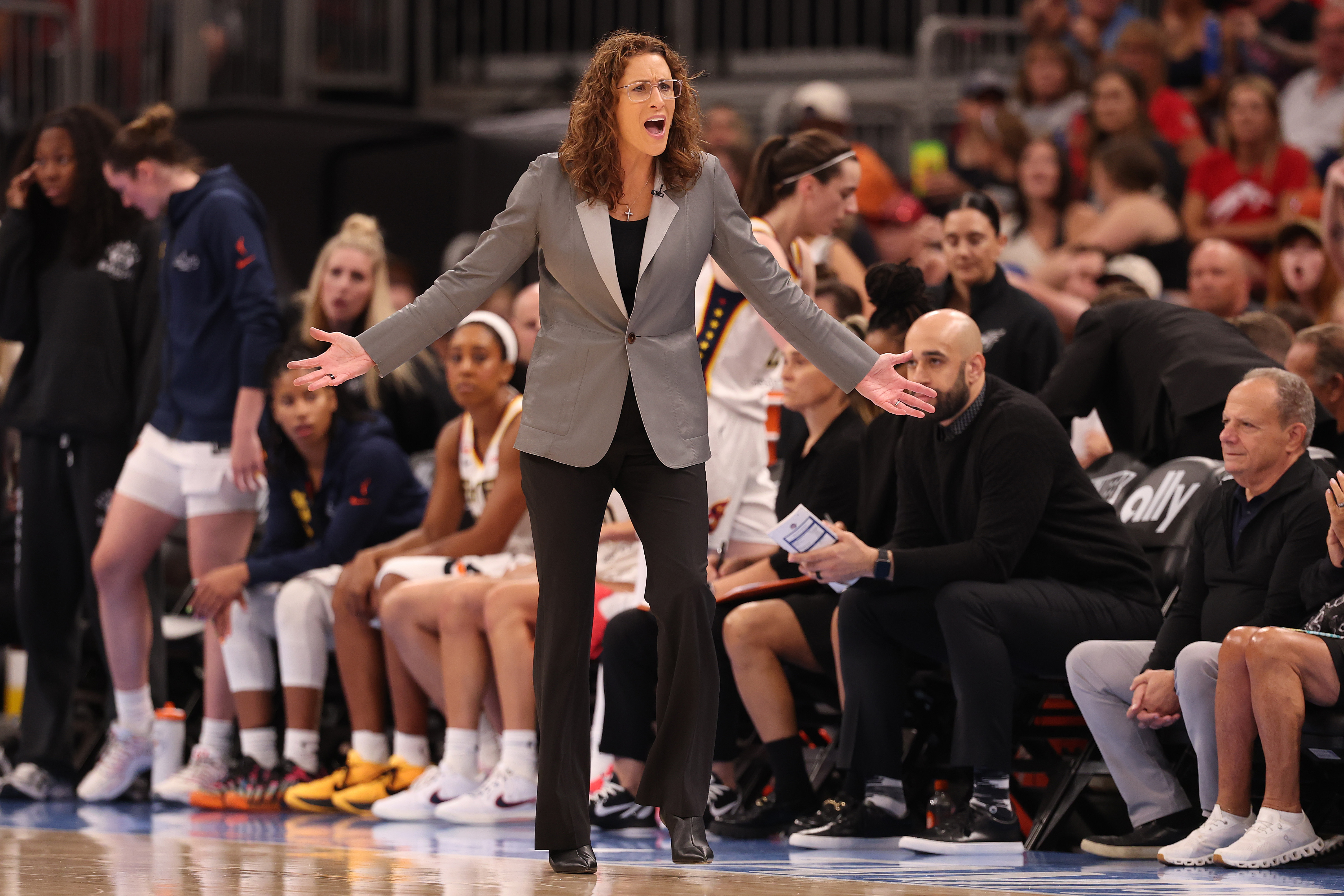 Indiana Fever head coach Stephanie White reacting on the sideline during a game against the Chicago Sky