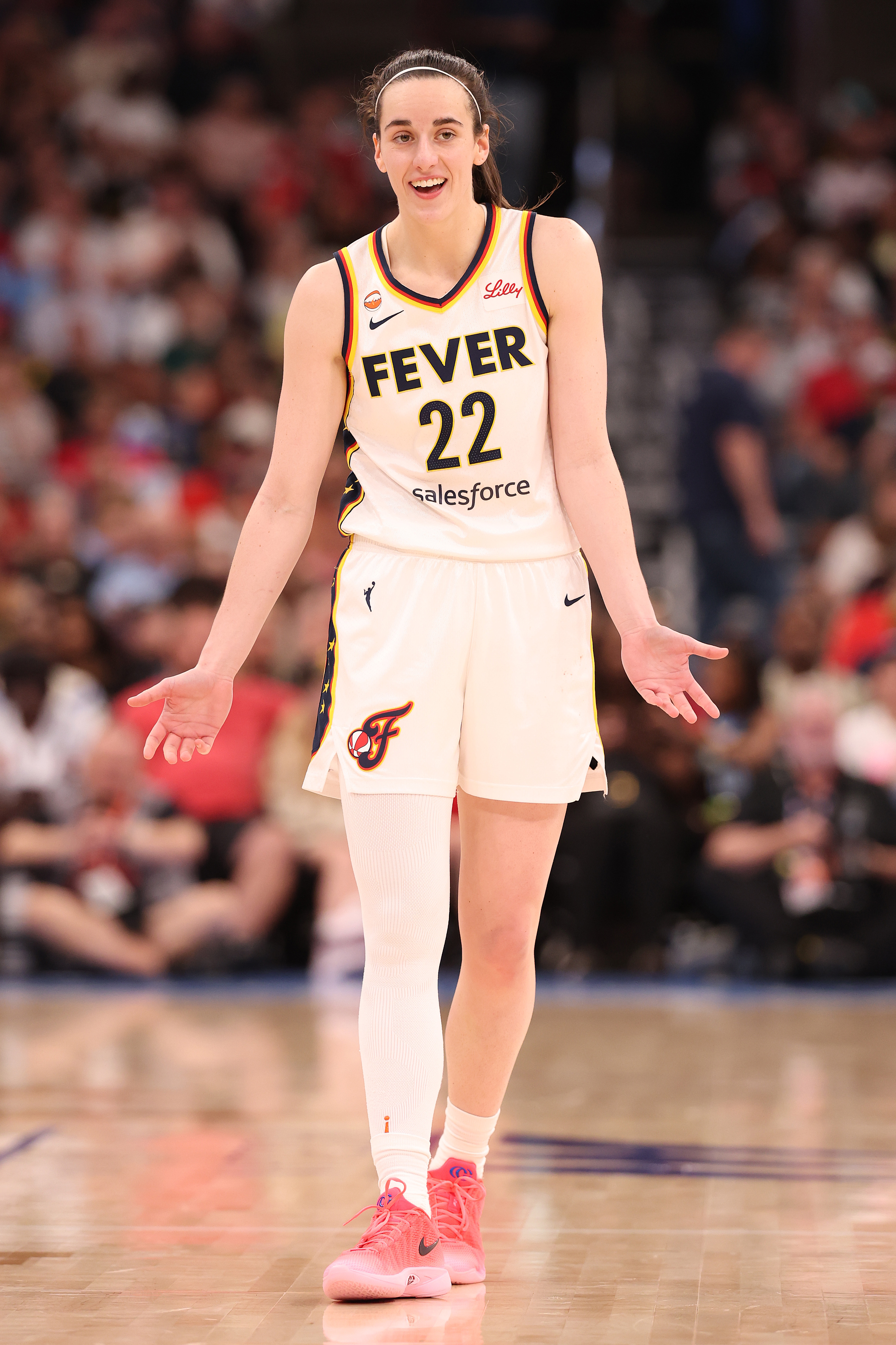 Caitlin Clark #22 of the Indiana Fever reacting during a game against the Chicago Sky at United Center