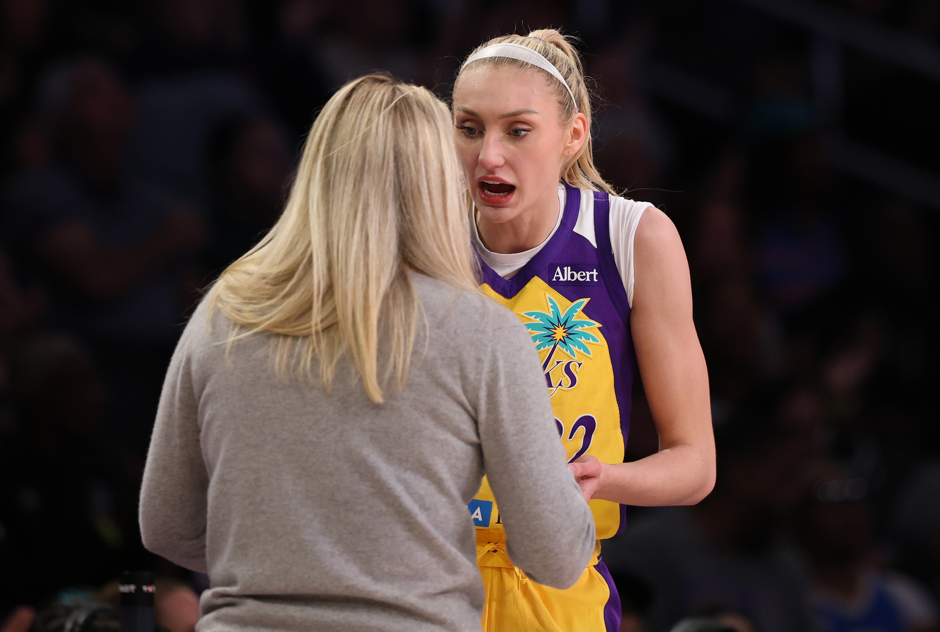 Cameron Brink #22 talking with Los Angeles Sparks head coach Lynne Roberts during a game at Crypto.com Arena