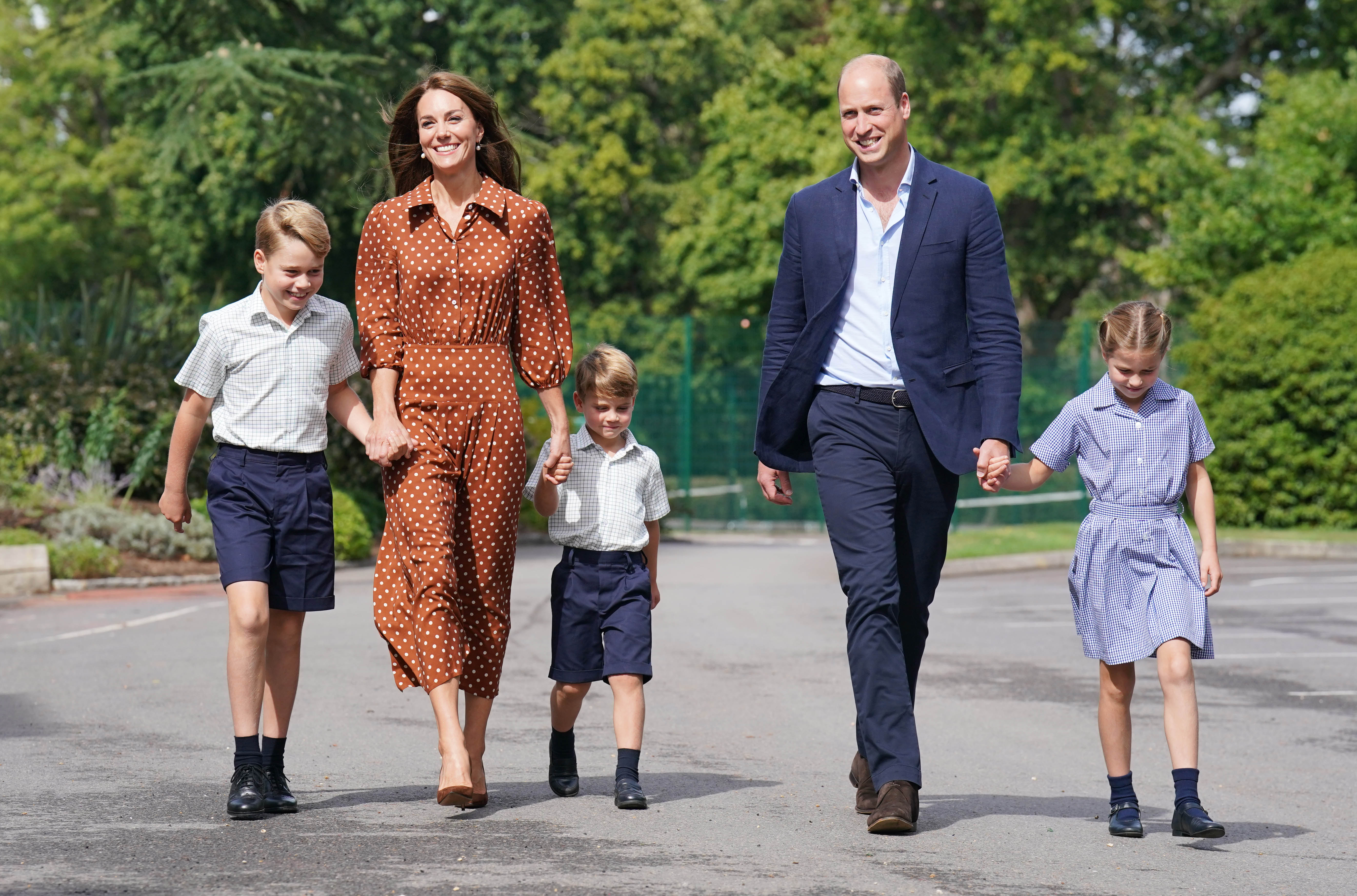Prince William and Catherine with their children Prince George, Princess Charlotte, and Prince Louis arriving at Lambrook School in Bracknell, England