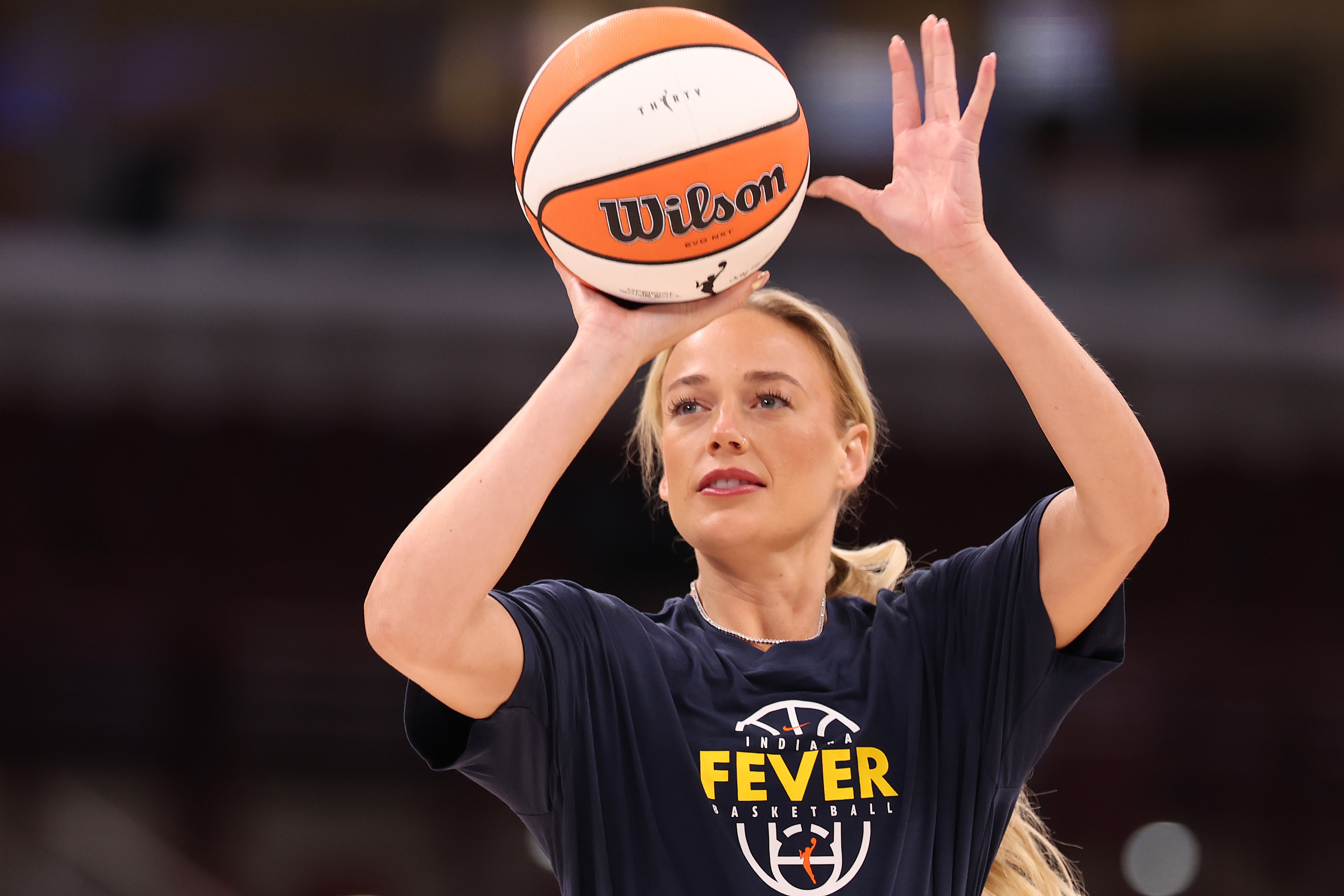 Sophie Cunningham in Indiana Fever uniform warming up on the court before a game against the Chicago Sky
