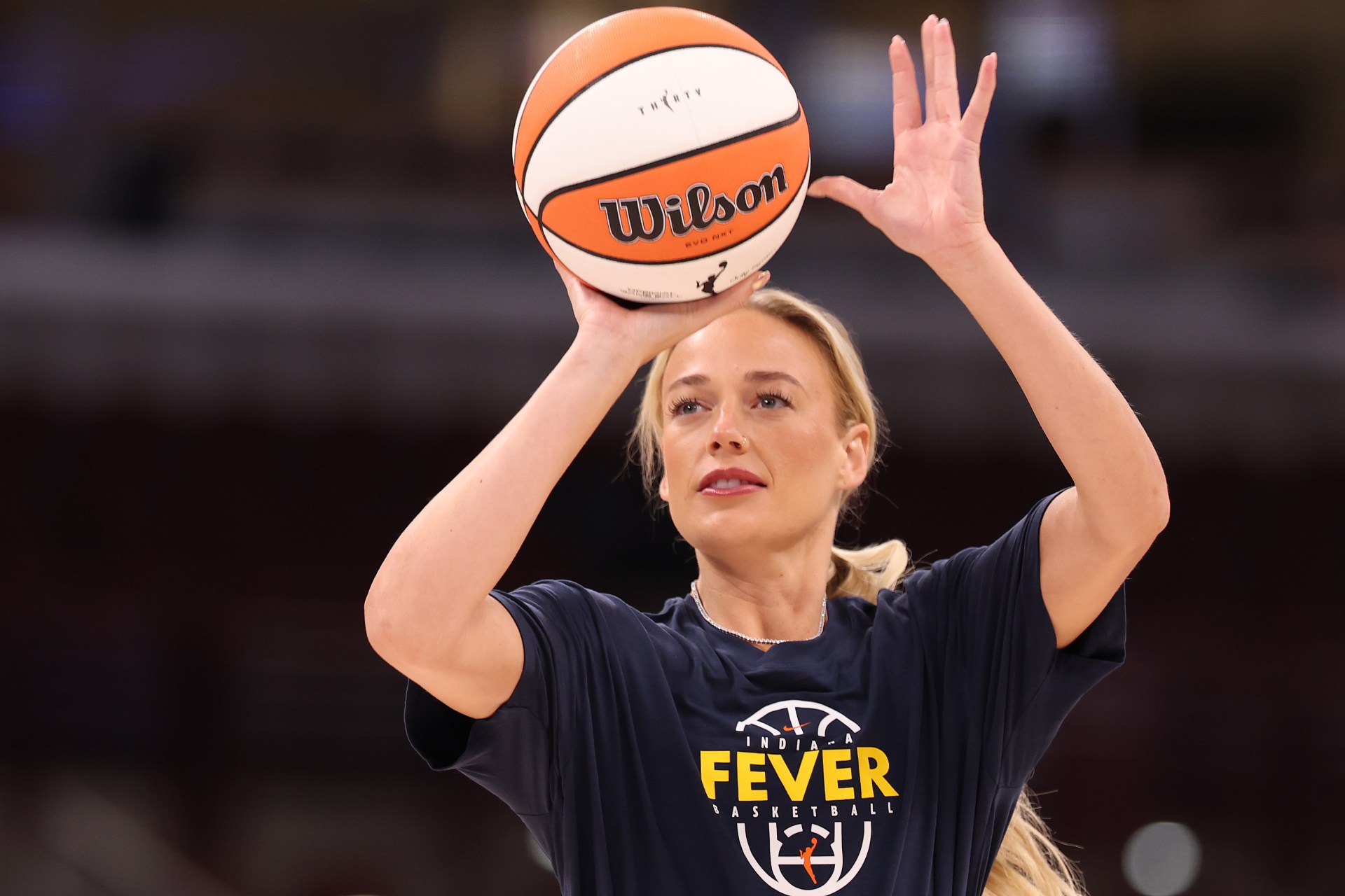 Sophie Cunningham in Indiana Fever uniform warming up on the court before a game against the Chicago Sky