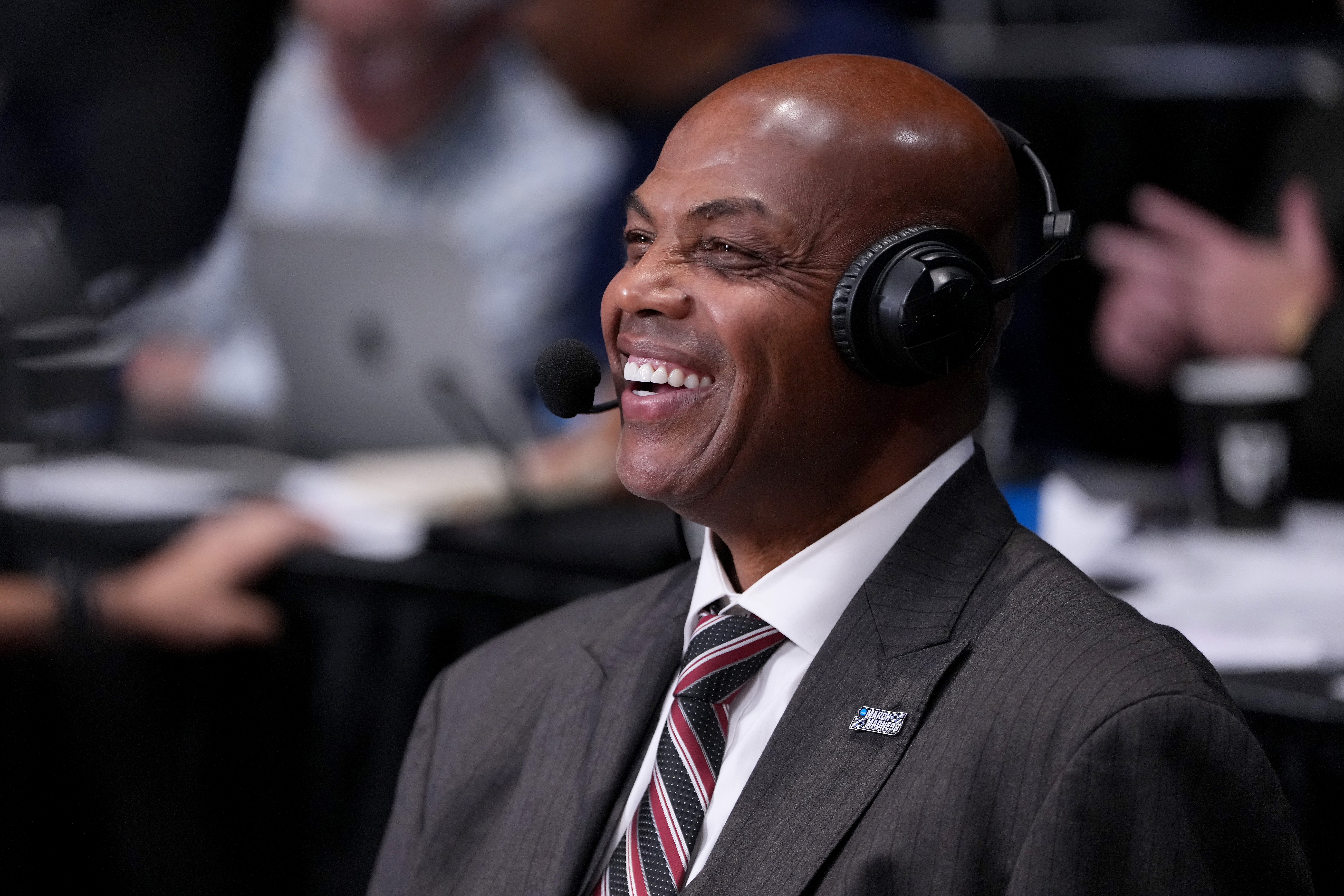Charles Barkley smiling courtside at UD Arena in Dayton, Ohio during the 2026 NCAA Tournament First Four game