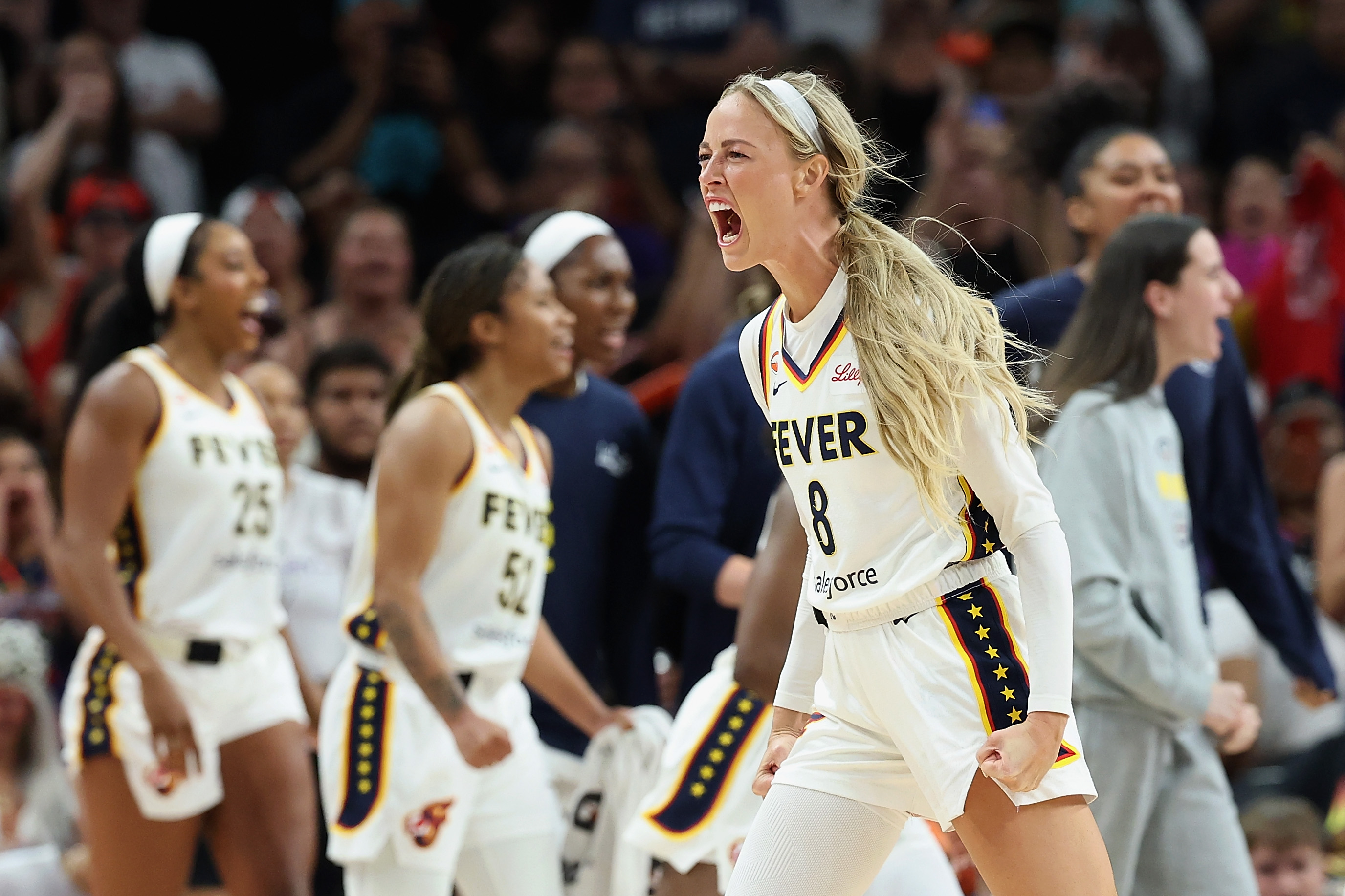 Sophie Cunningham #8 of the Indiana Fever celebrating on the court after a WNBA win over the Phoenix Mercury
