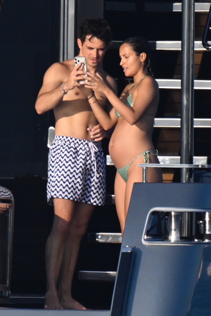 Alexandra Saint Mieux in a green bikini on a yacht off Sardinia with Charles Leclerc and their dachshund Leo