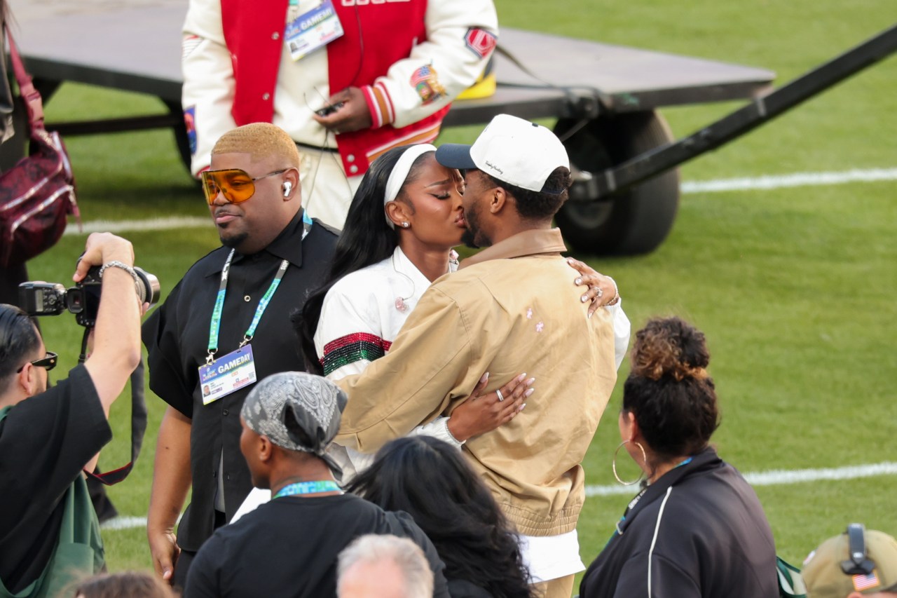 Coco Jones and Donovan Mitchell posing together at Levi's Stadium after her Super Bowl LX performance